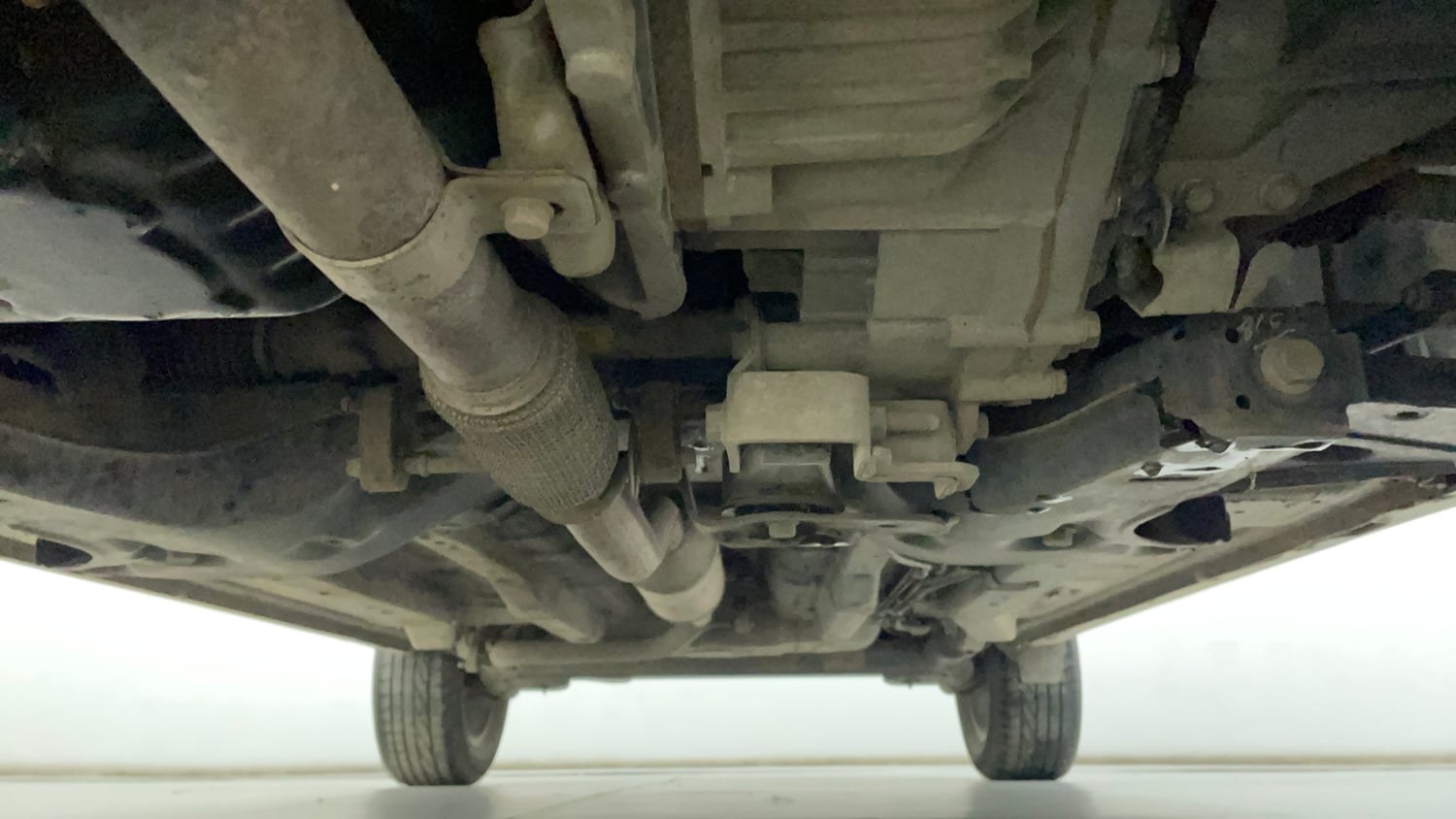 Used 2023 Tata Nexon XZA Plus LUXS Red Dark Edition Petrol Automatic extra FRONT LEFT UNDERBODY VIEW