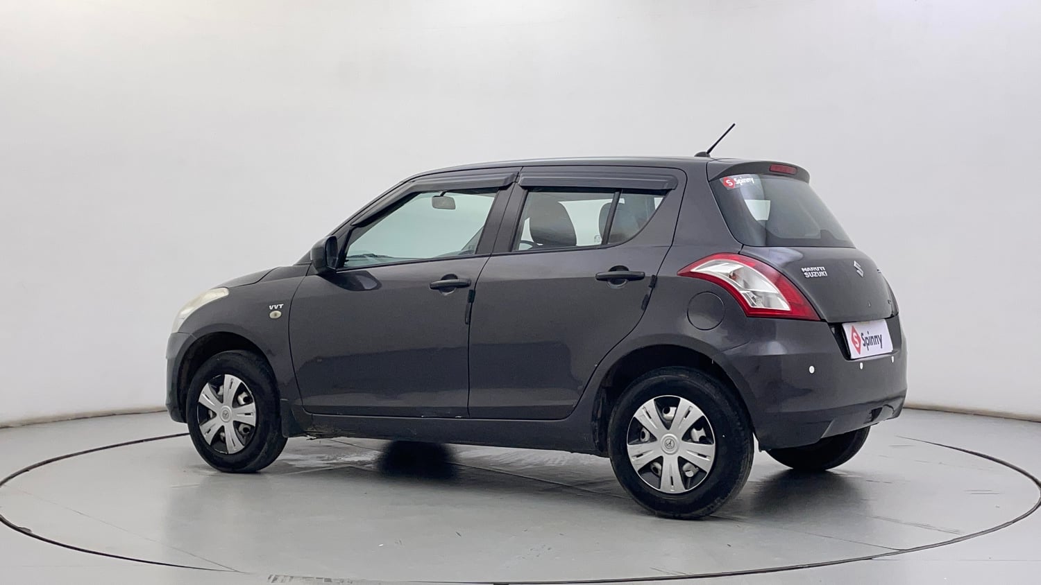 Used 2016 Maruti Suzuki Swift Lxi (O) Petrol Manual exterior LEFT REAR CORNER VIEW