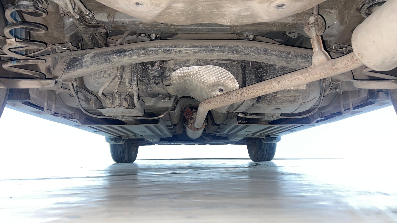 Used 2024 Maruti Suzuki Grand Vitara Alpha Smart Hybrid AT Petrol Automatic extra REAR UNDERBODY VIEW (TAKEN FROM REAR)