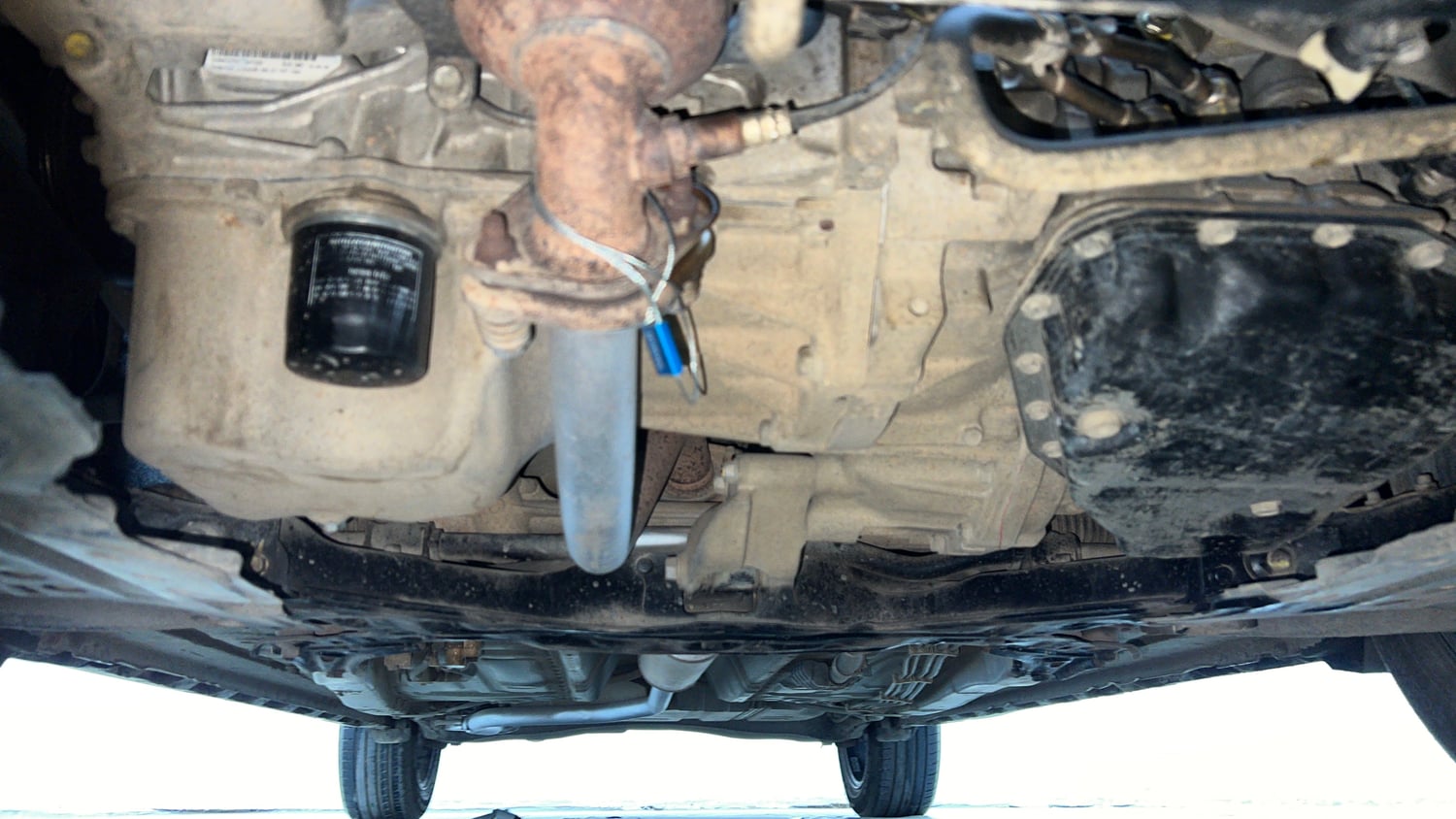 Used 2021 Maruti Suzuki XL6 Zeta AT Petrol Petrol Automatic extra FRONT LEFT UNDERBODY VIEW