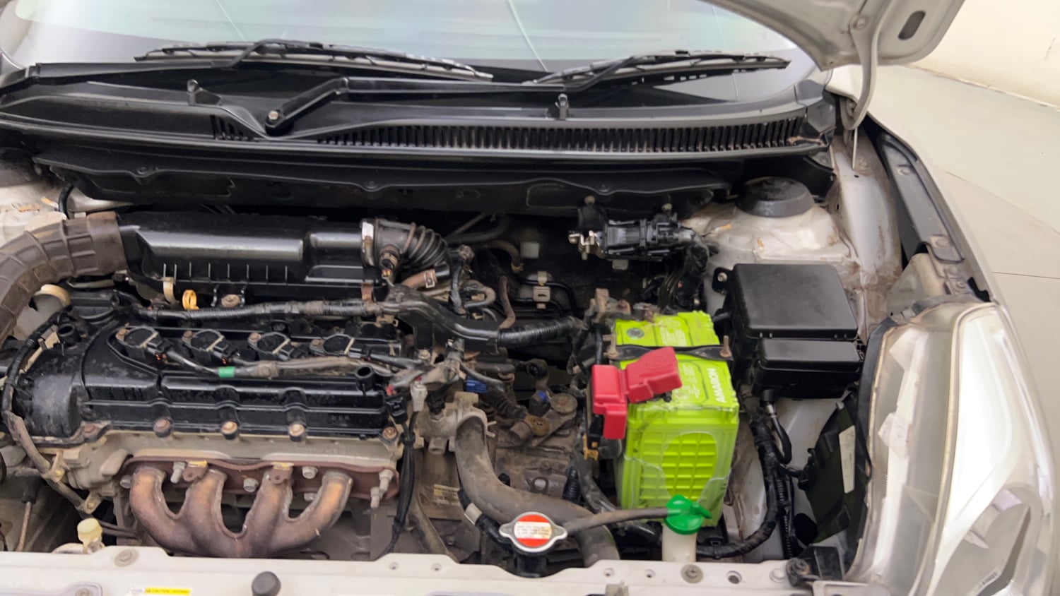 Used 2017 Maruti Suzuki Baleno Zeta 1.2 Petrol Manual engine ENGINE LEFT SIDE HINGE & APRON VIEW