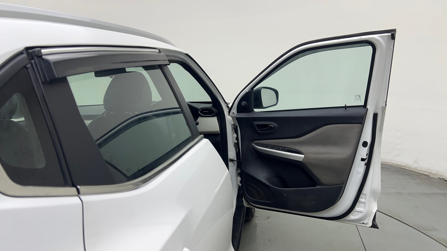 Used 2023 Nissan Magnite XE Petrol Manual interior RIGHT FRONT DOOR OPEN VIEW