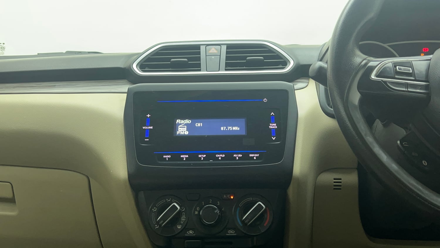 Used 2022 Maruti Suzuki Dzire VXi CNG Cng Manual top_features Integrated (in-dash) music system