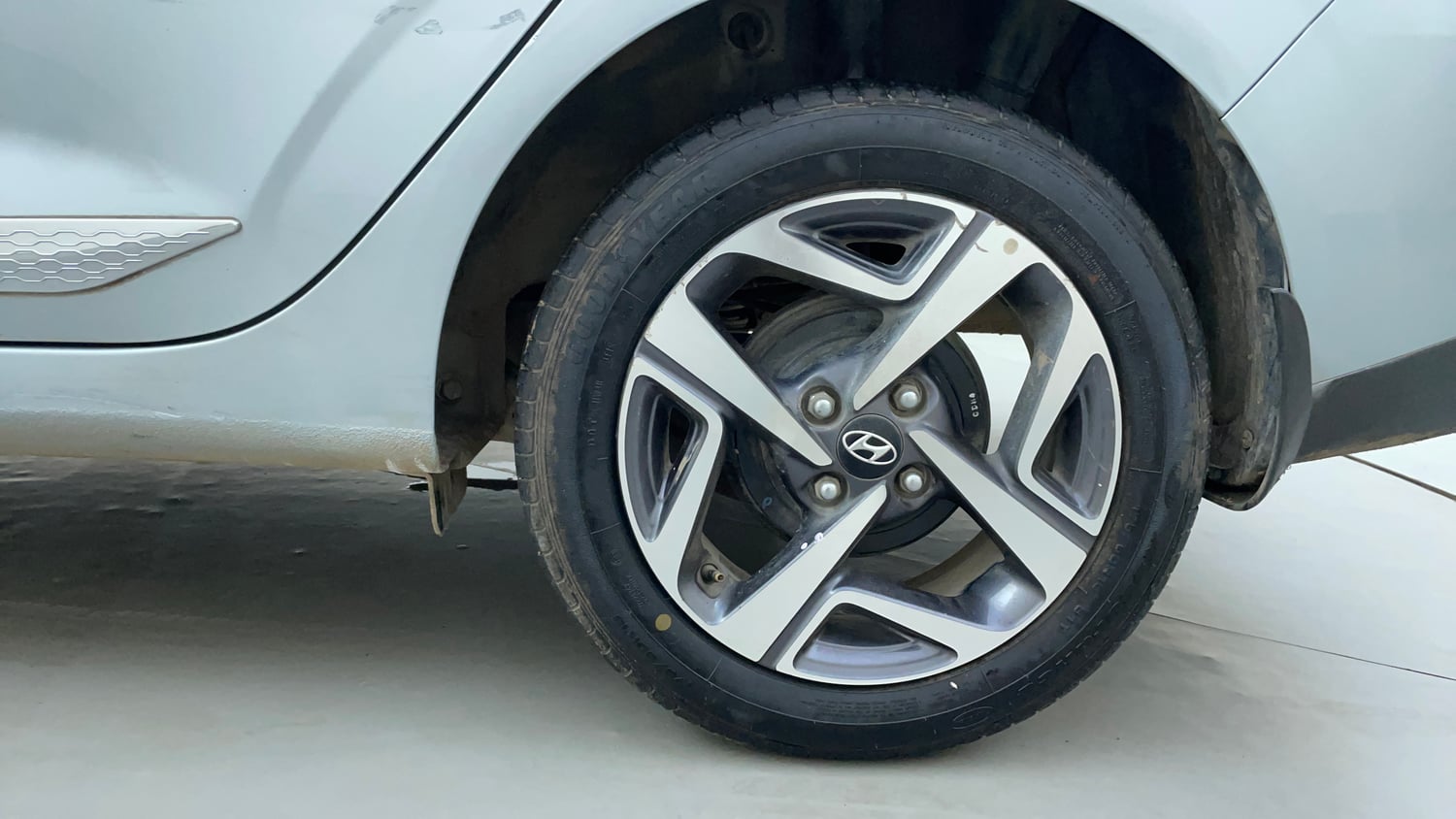 Used 2022 Hyundai Aura SX 1.2 Petrol Petrol Manual tyres LEFT REAR TYRE RIM VIEW