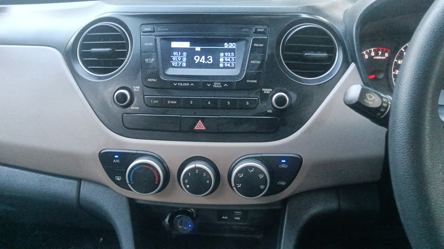 Used 2016 Hyundai Grand i10 Sportz 1.2 Kappa VTVT Petrol Manual interior MUSIC SYSTEM & AC CONTROL VIEW