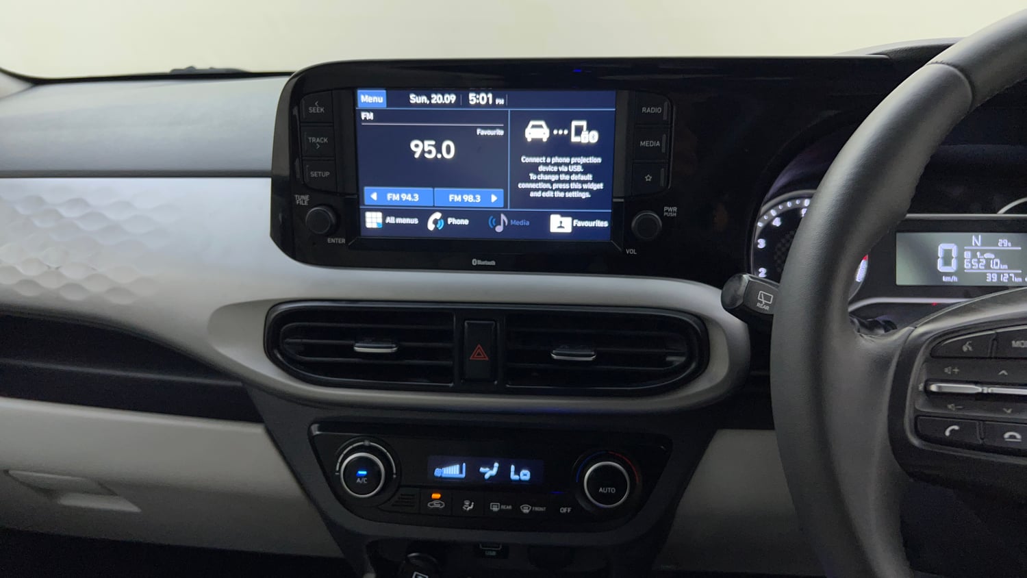 Used 2021 Hyundai Grand i10 Nios Asta AMT 1.2 Kappa VTVT Petrol Automatic top_features Integrated (in-dash) music system
