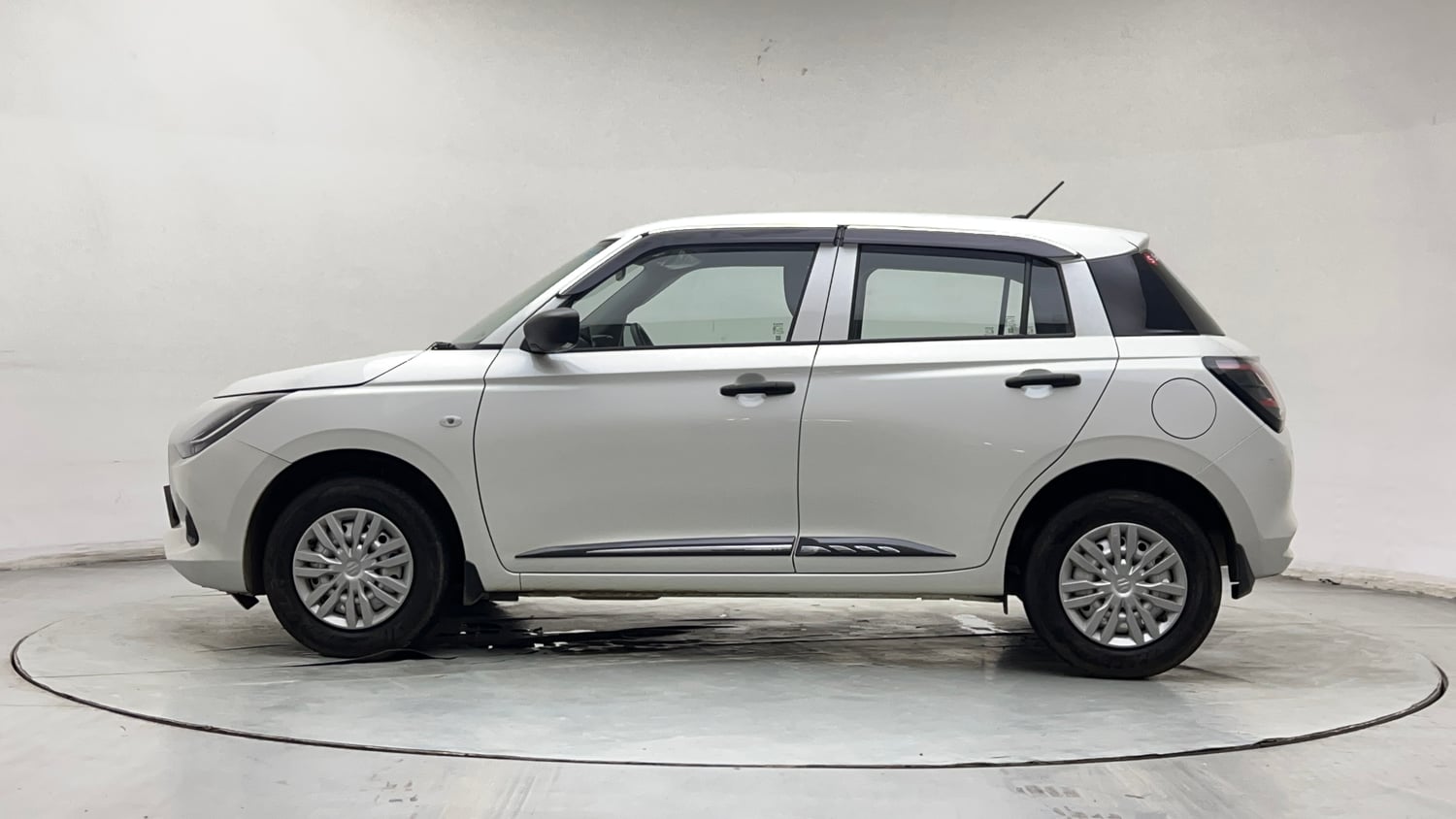 Used 2026 Maruti Suzuki Swift LXi Petrol Manual exterior LEFT SIDE VIEW