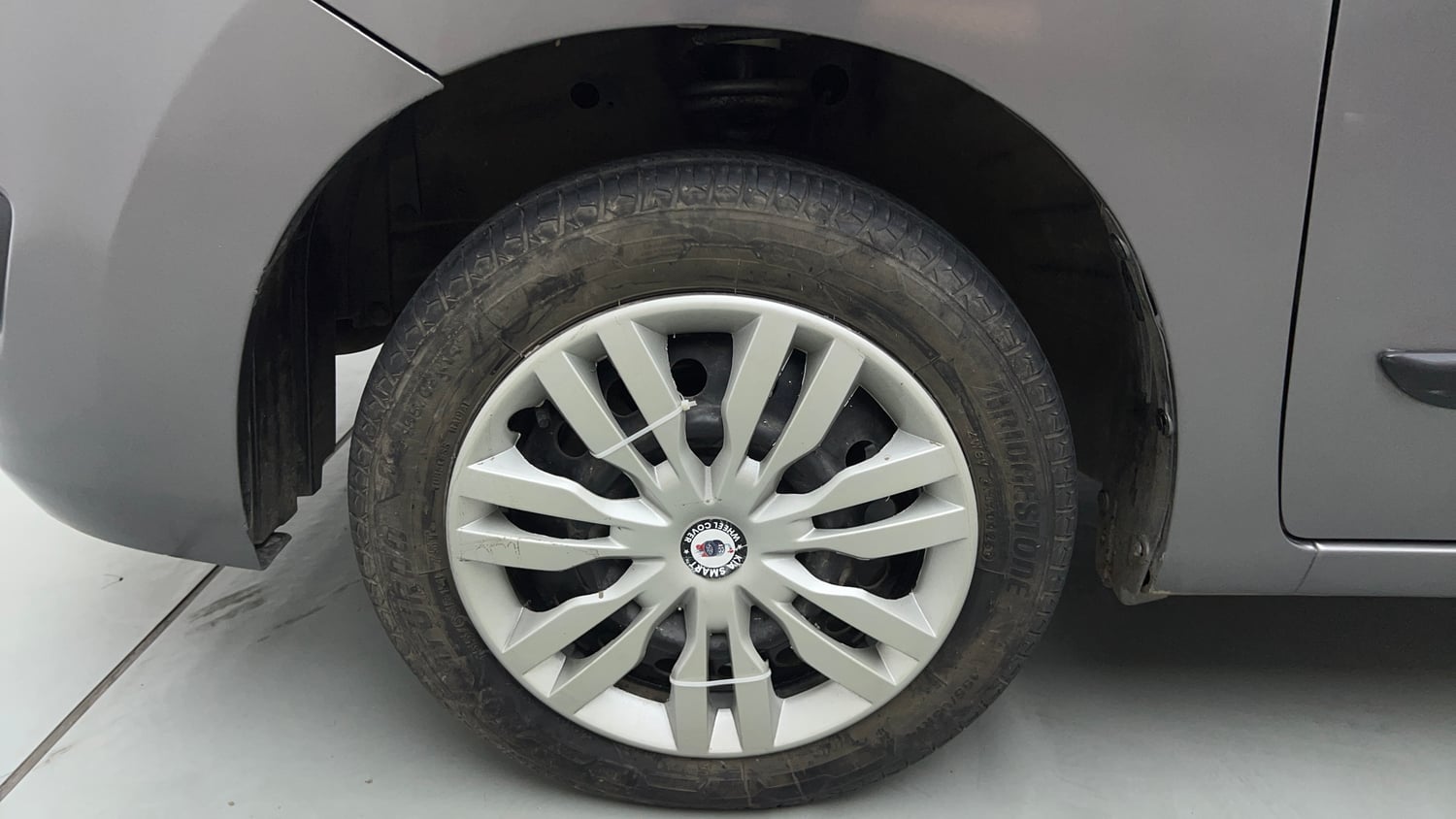 Used 2013 Maruti Suzuki Wagon R VXI Petrol Manual tyres LEFT FRONT TYRE RIM VIEW