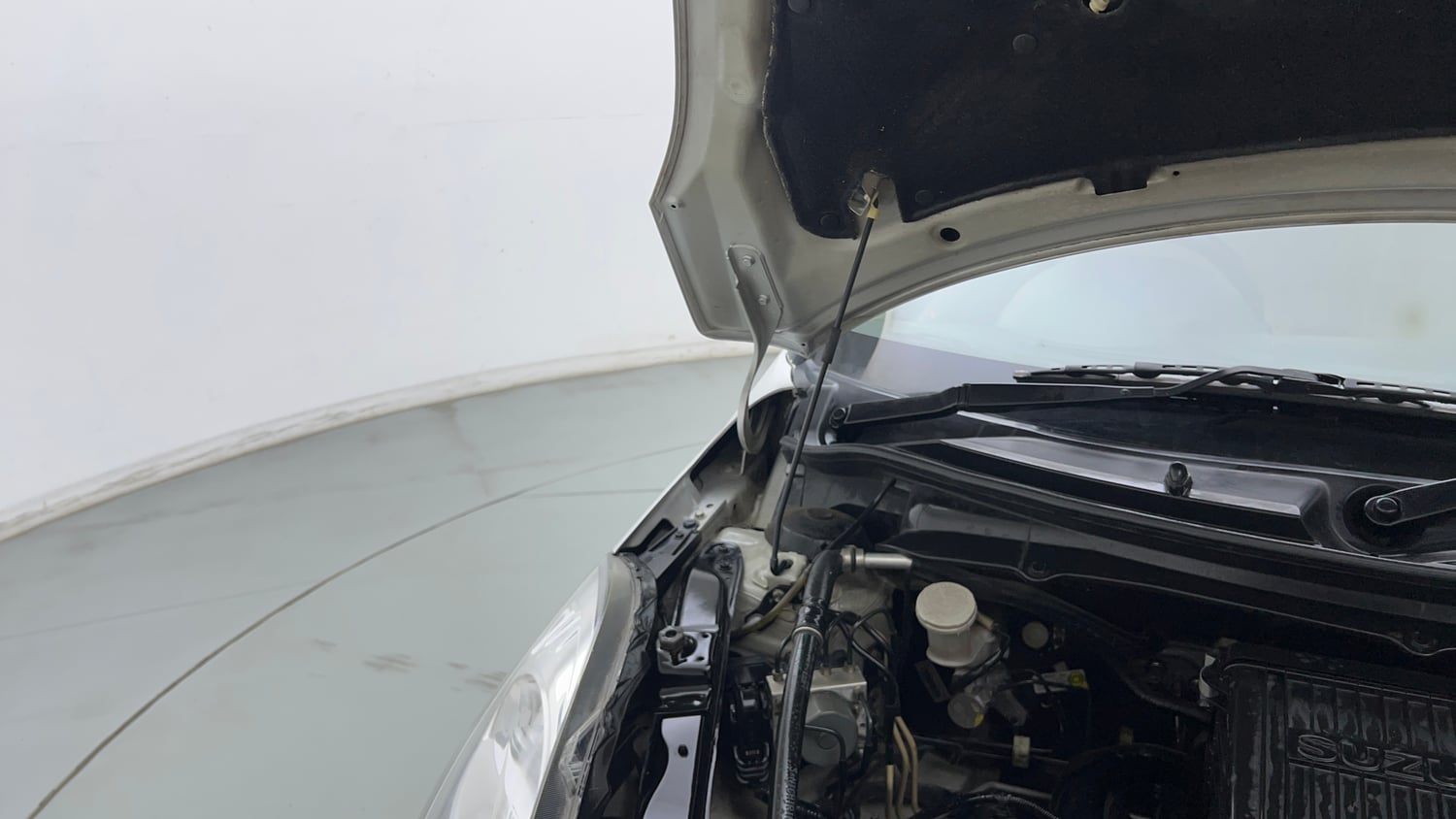 Used 2016 Maruti Suzuki Swift Dzire VXI (O) Petrol Manual engine ENGINE RIGHT SIDE HINGE & APRON VIEW