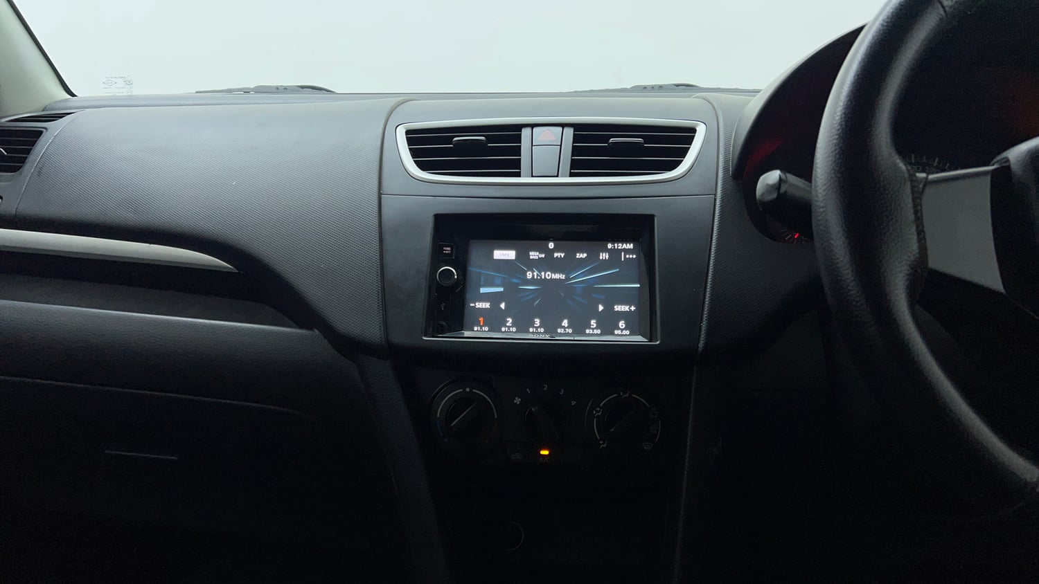Used 2017 Maruti Suzuki Swift Lxi (O) Petrol Manual interior MUSIC SYSTEM & AC CONTROL VIEW