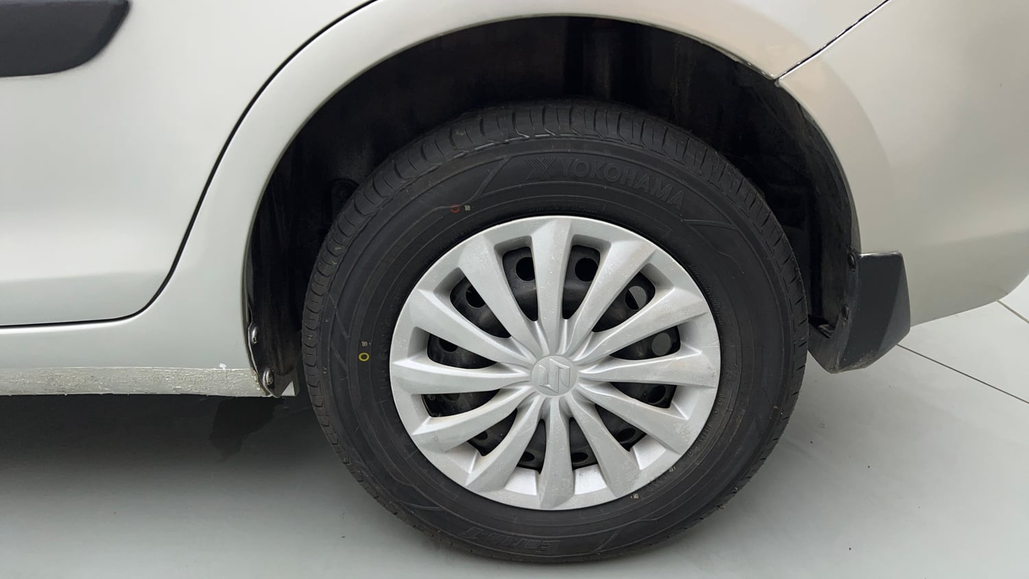 Used 2016 Maruti Suzuki Swift Dzire VXI (O) Petrol Manual tyres LEFT REAR TYRE RIM VIEW