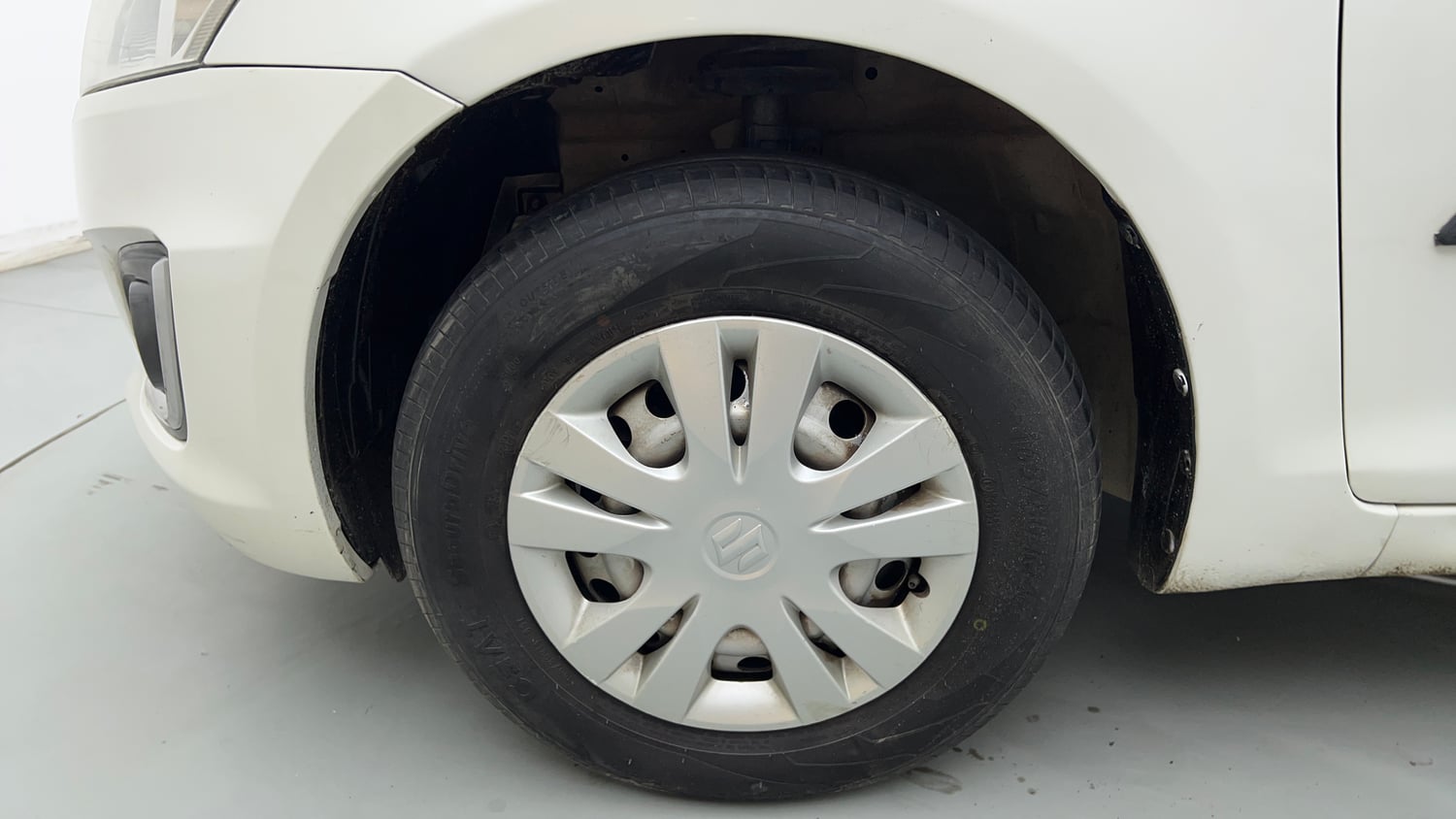 Used 2017 Maruti Suzuki Swift Lxi (O) Petrol Manual tyres LEFT FRONT TYRE RIM VIEW
