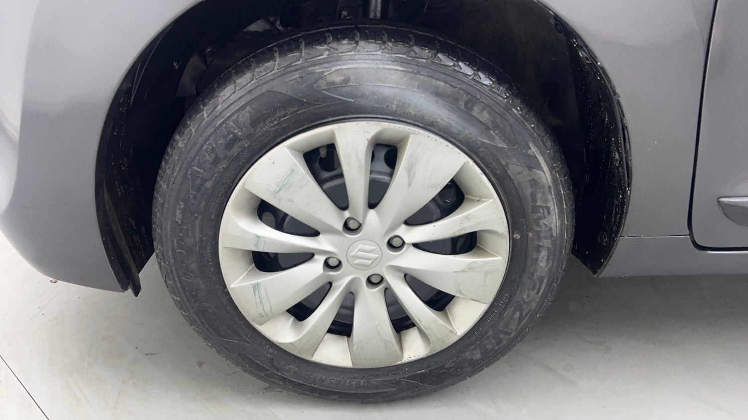 Used 2018 Maruti Suzuki Baleno Delta 1.2 Petrol Manual tyres LEFT FRONT TYRE RIM VIEW