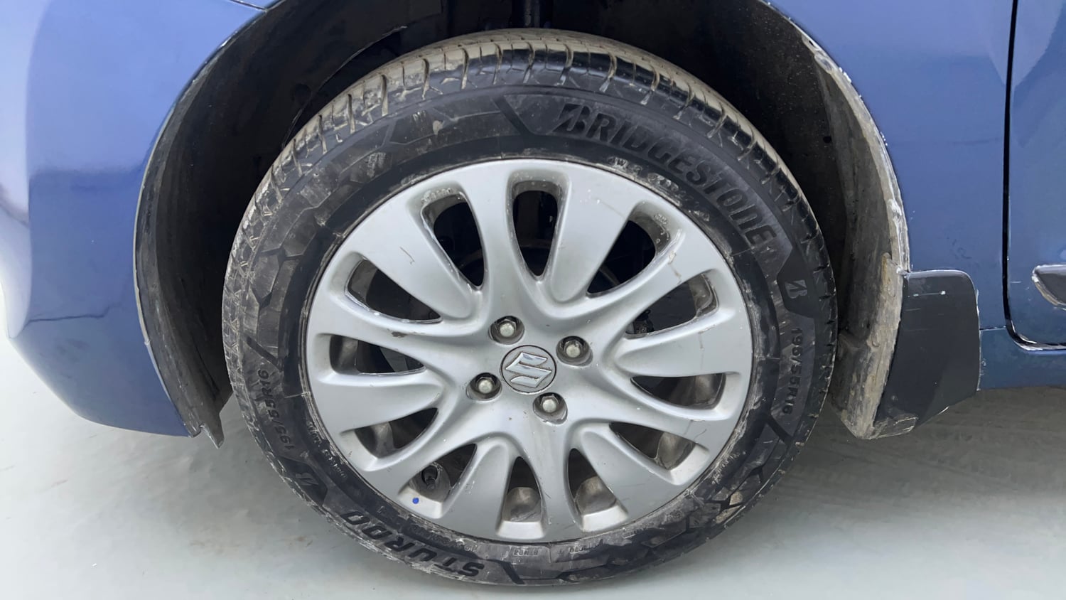 Used 2017 Maruti Suzuki Baleno Zeta 1.2 Petrol Manual tyres LEFT FRONT TYRE RIM VIEW