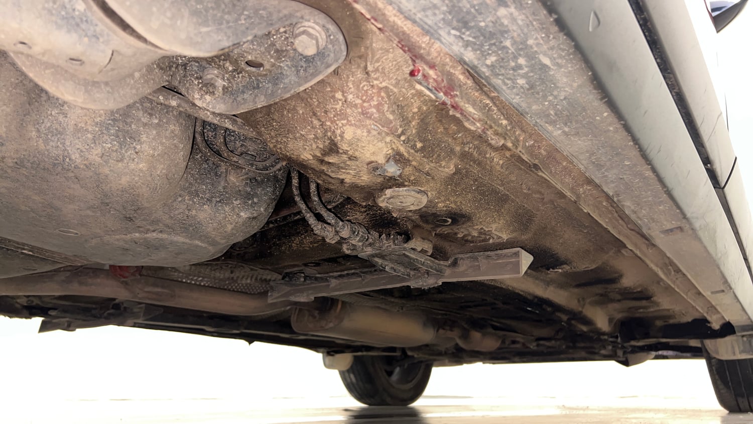 Used 2023 Volkswagen Taigun Topline 1.0 TSI AT Petrol Automatic extra REAR RIGHT UNDERBODY VIEW