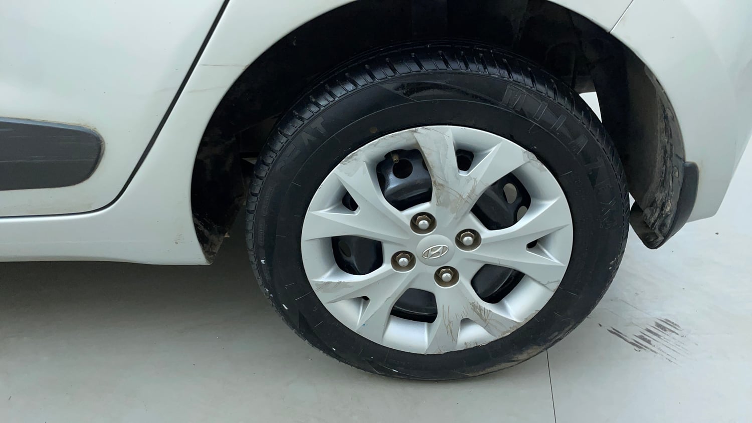 Used 2015 Hyundai Grand i10 Sportz 1.2 Kappa VTVT Petrol Manual tyres LEFT REAR TYRE RIM VIEW