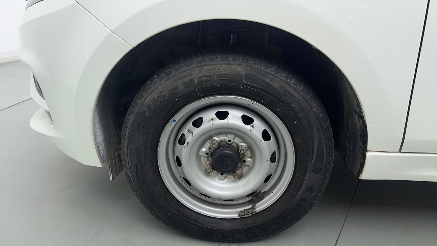 Used 2025 Tata Tiago XE Petrol Manual tyres LEFT FRONT TYRE RIM VIEW