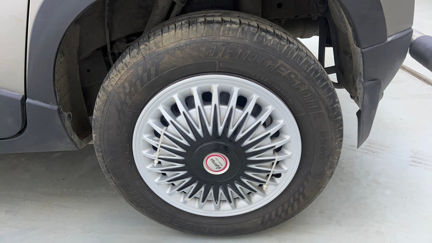 Used 2016 Mahindra KUV100 K6+ 6 STR Petrol Manual tyres LEFT REAR TYRE RIM VIEW