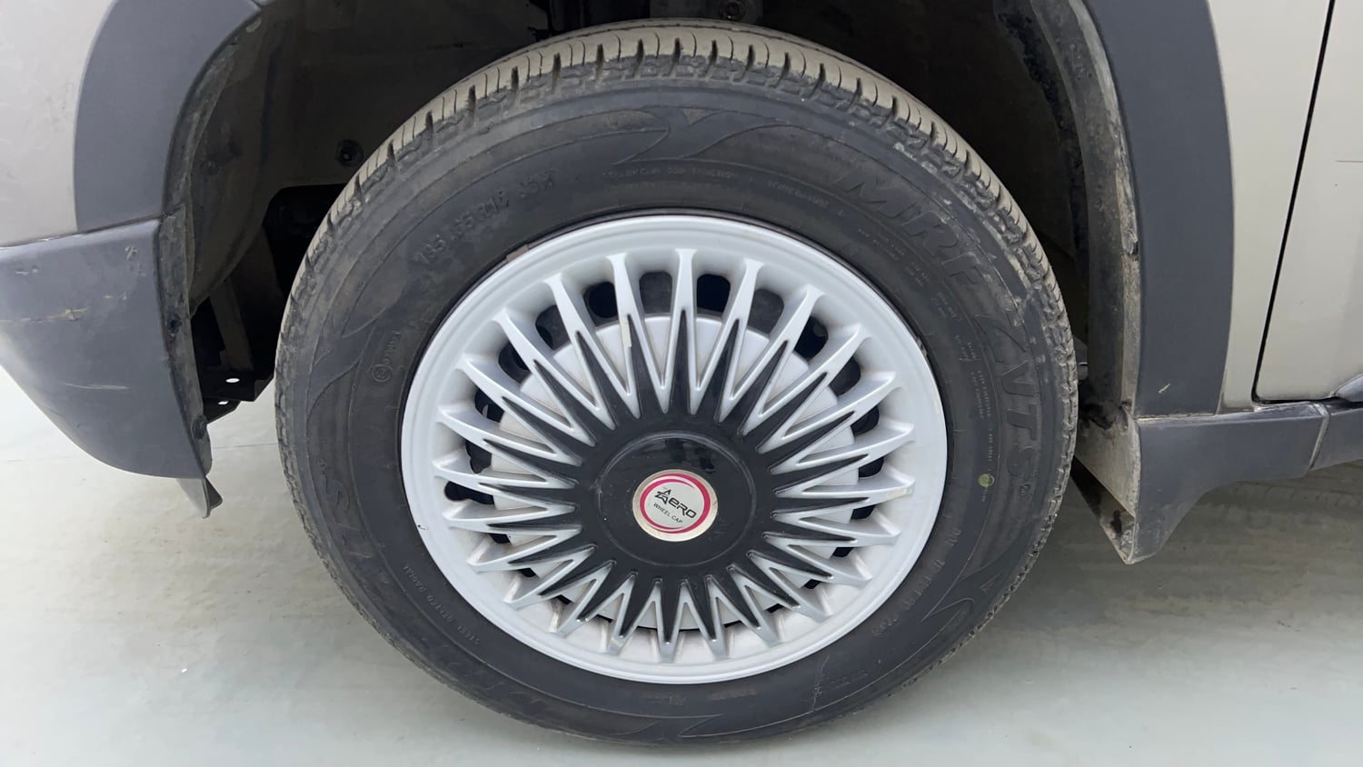 Used 2016 Mahindra KUV100 K6+ 6 STR Petrol Manual tyres LEFT FRONT TYRE RIM VIEW