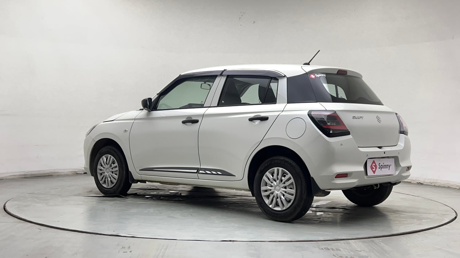 Used 2026 Maruti Suzuki Swift LXi Petrol Manual exterior LEFT REAR CORNER VIEW