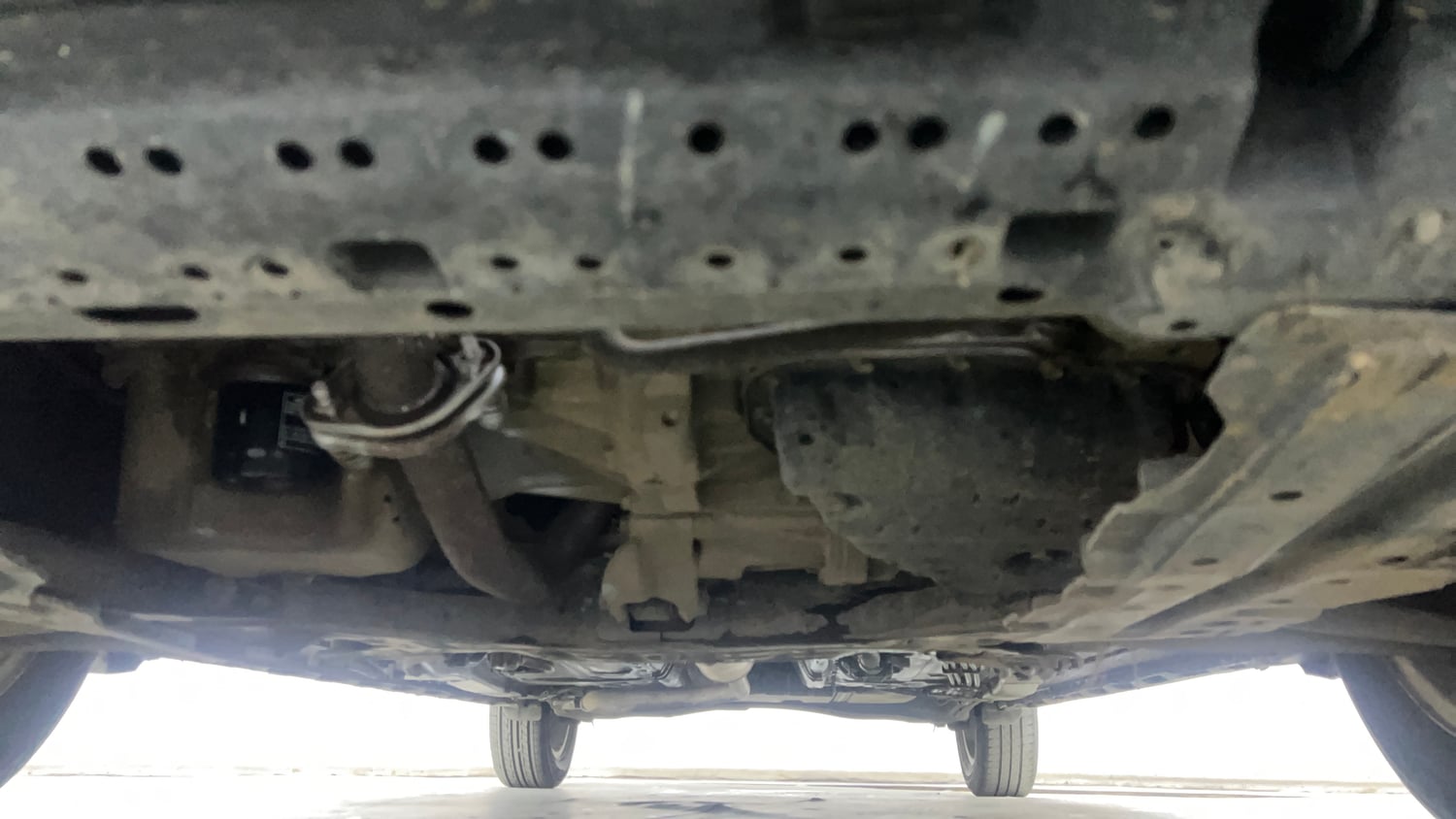 Used 2022 Maruti Suzuki XL6 Alpha AT Petrol Petrol Automatic extra FRONT LEFT UNDERBODY VIEW