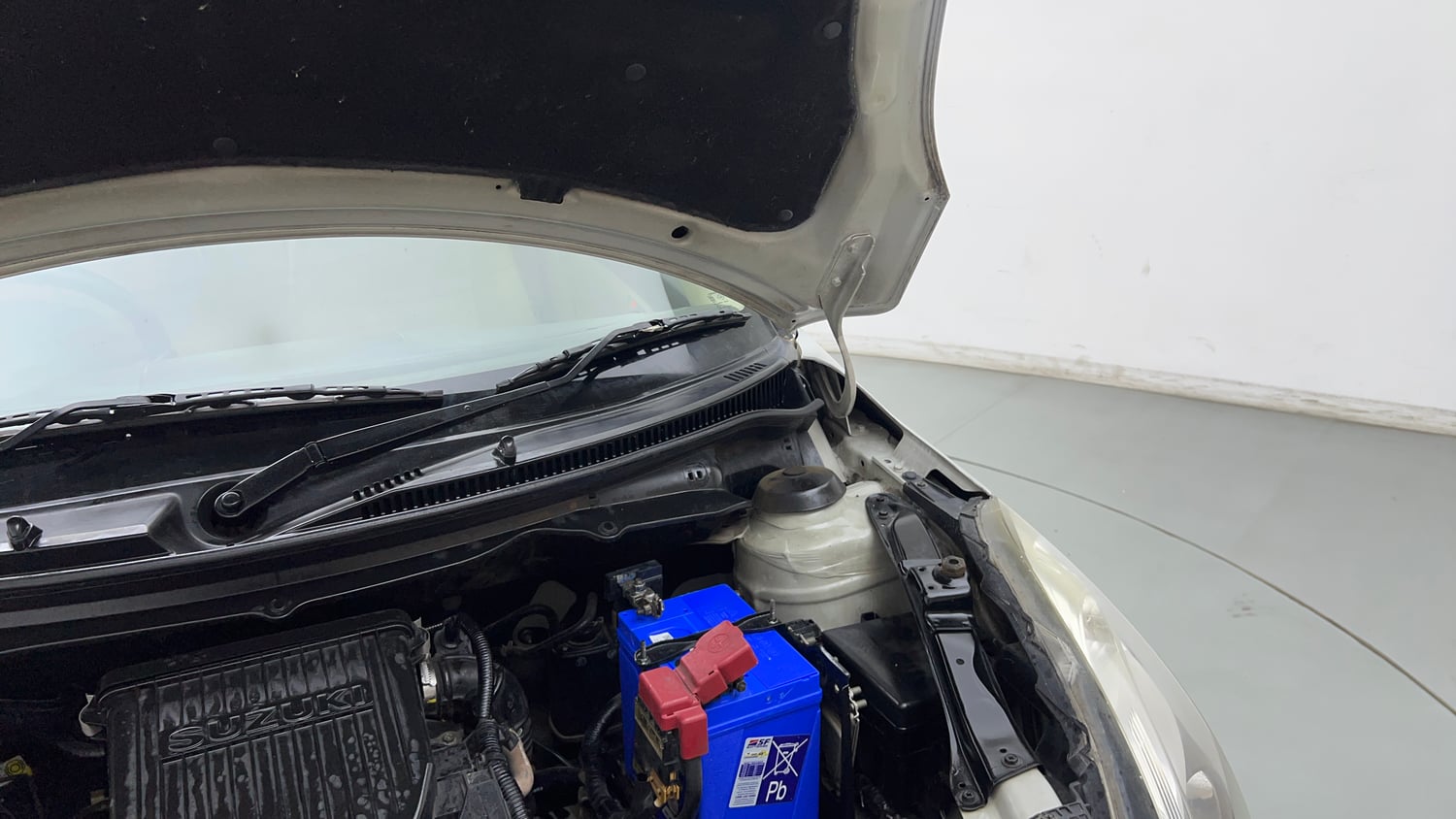 Used 2016 Maruti Suzuki Swift Dzire VXI (O) Petrol Manual engine ENGINE LEFT SIDE HINGE & APRON VIEW
