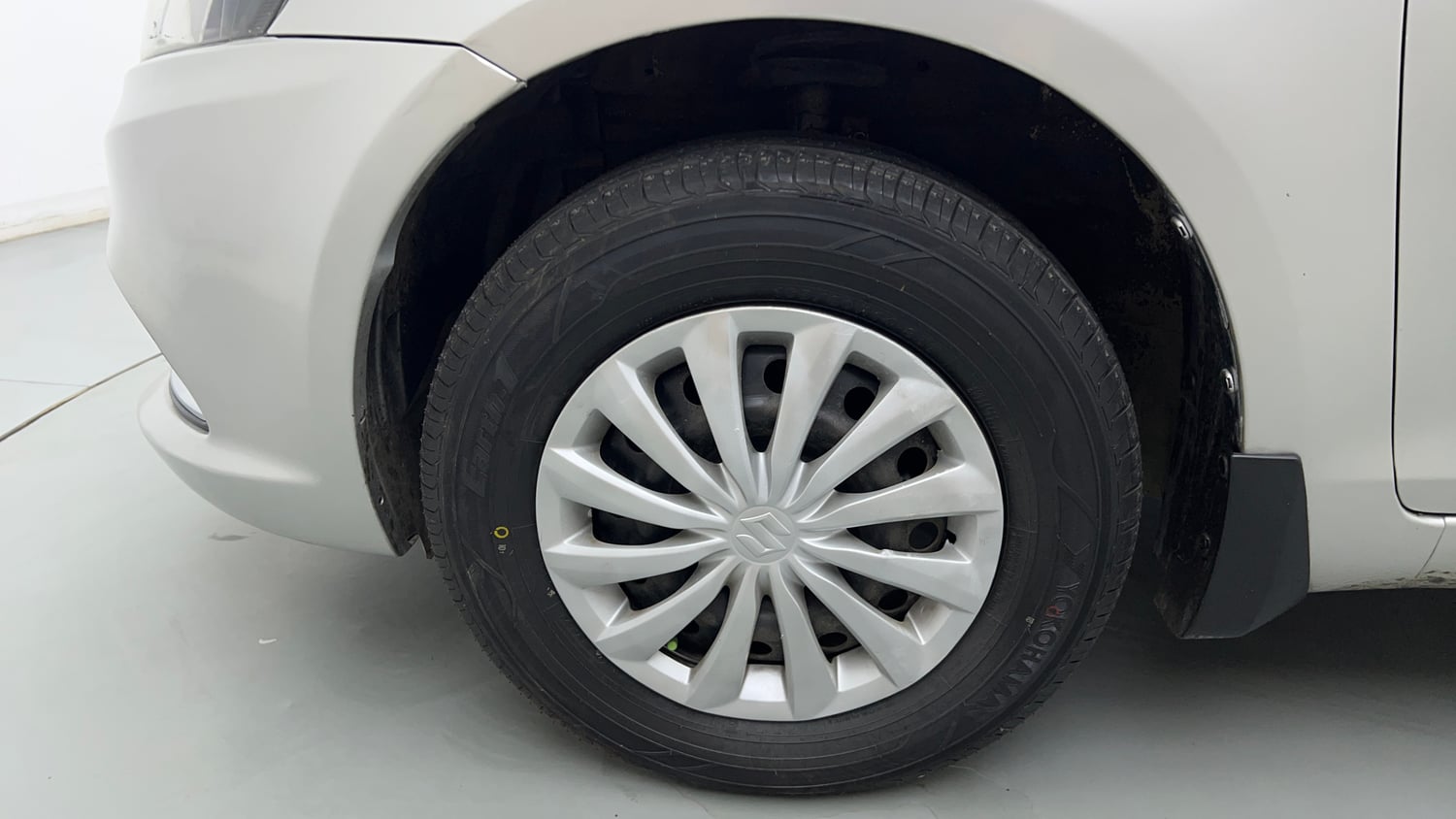Used 2016 Maruti Suzuki Swift Dzire VXI (O) Petrol Manual tyres LEFT FRONT TYRE RIM VIEW