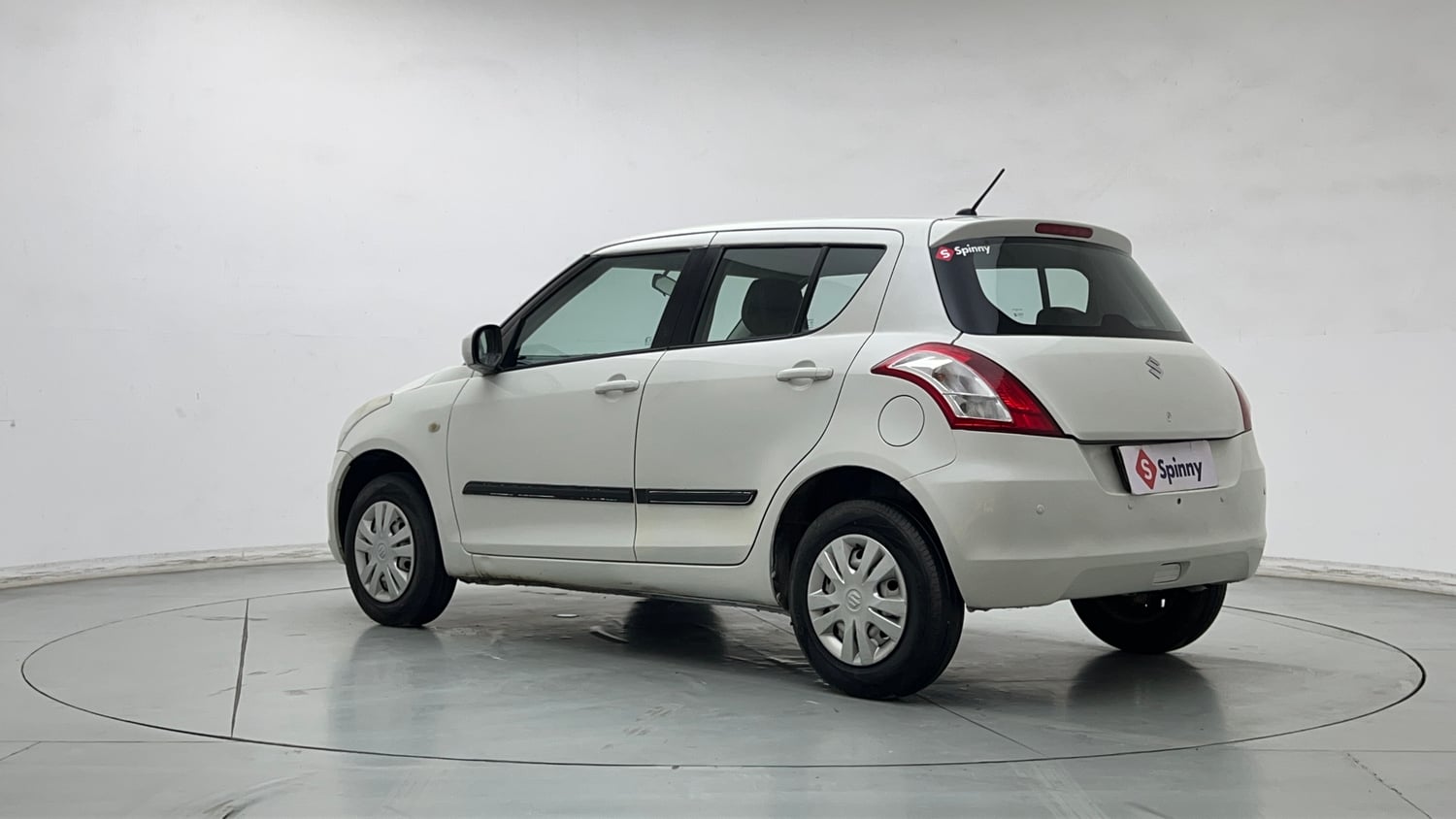 Used 2017 Maruti Suzuki Swift Lxi (O) Petrol Manual exterior LEFT REAR CORNER VIEW