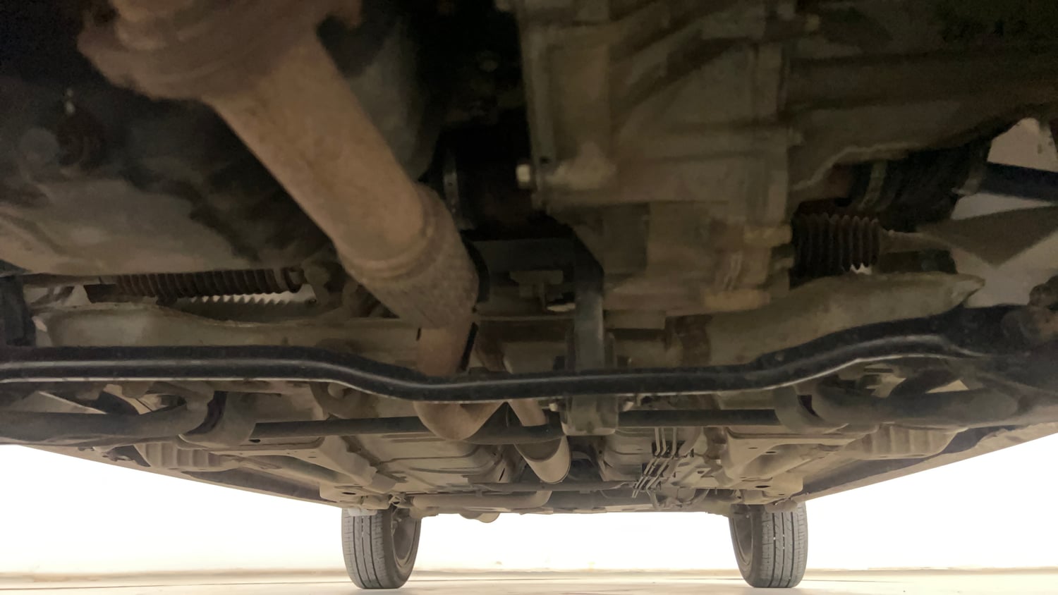 Used 2024 Tata Tigor XZ Plus Petrol Manual extra FRONT LEFT UNDERBODY VIEW