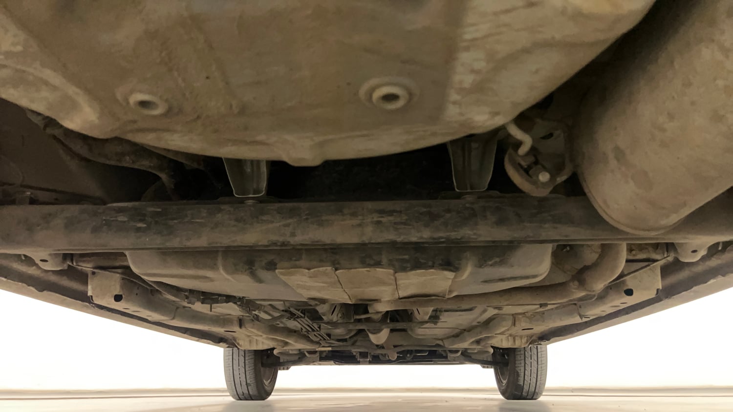 Used 2024 Tata Tigor XZ Plus Petrol Manual extra REAR UNDERBODY VIEW (TAKEN FROM REAR)