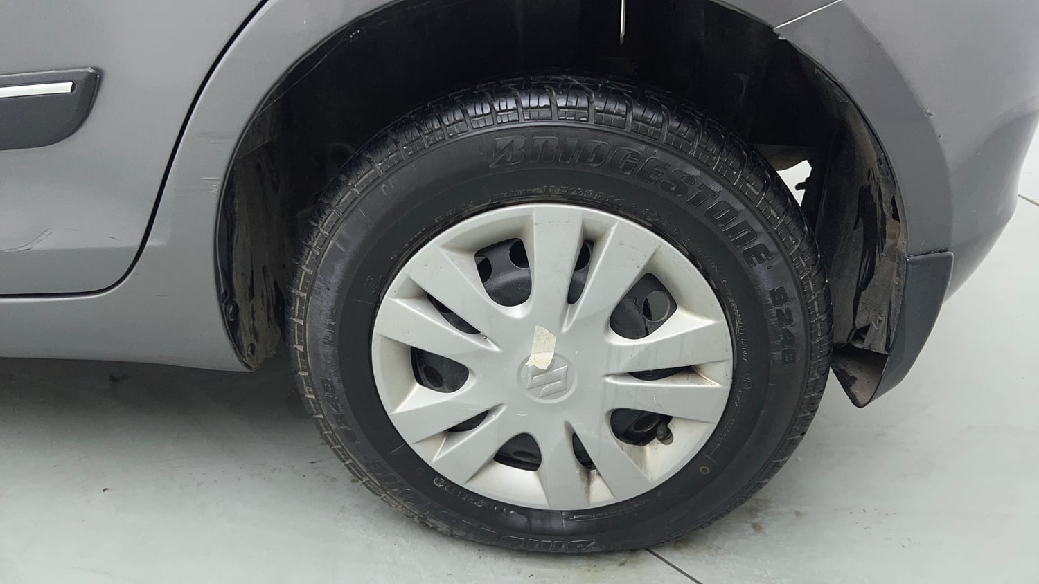 Used 2014 Maruti Suzuki Swift LXi Petrol Manual tyres LEFT REAR TYRE RIM VIEW