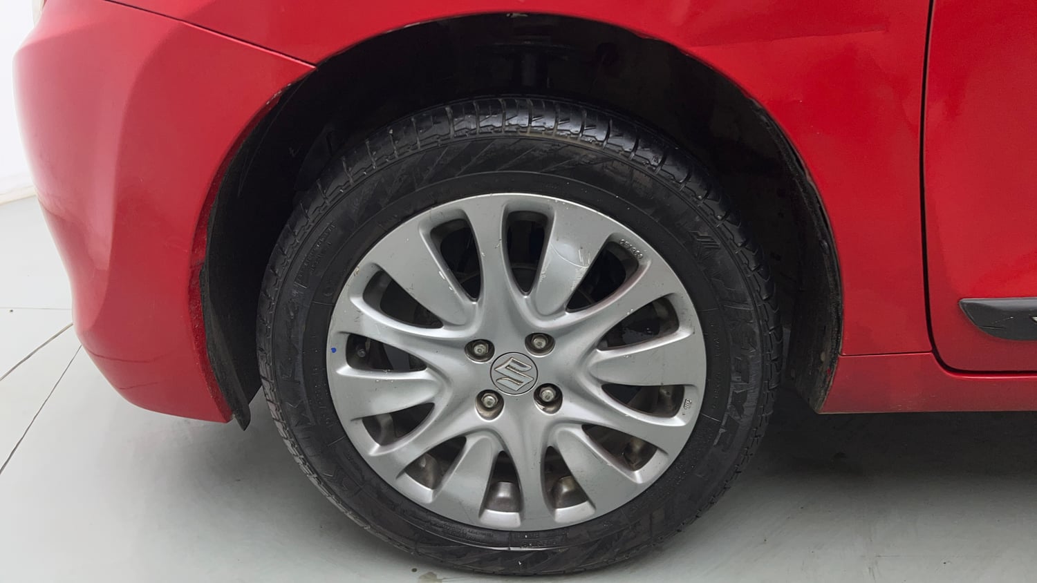Used 2016 Maruti Suzuki Baleno Zeta 1.2 Petrol Manual tyres LEFT FRONT TYRE RIM VIEW