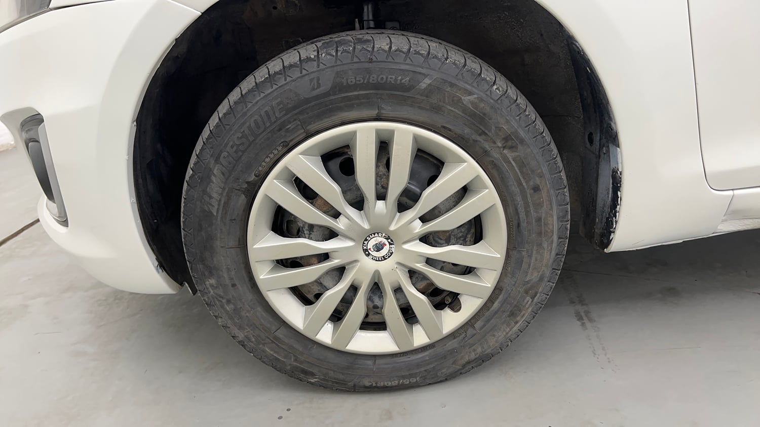 Used 2014 Maruti Suzuki Swift VXi Petrol Manual tyres LEFT FRONT TYRE RIM VIEW