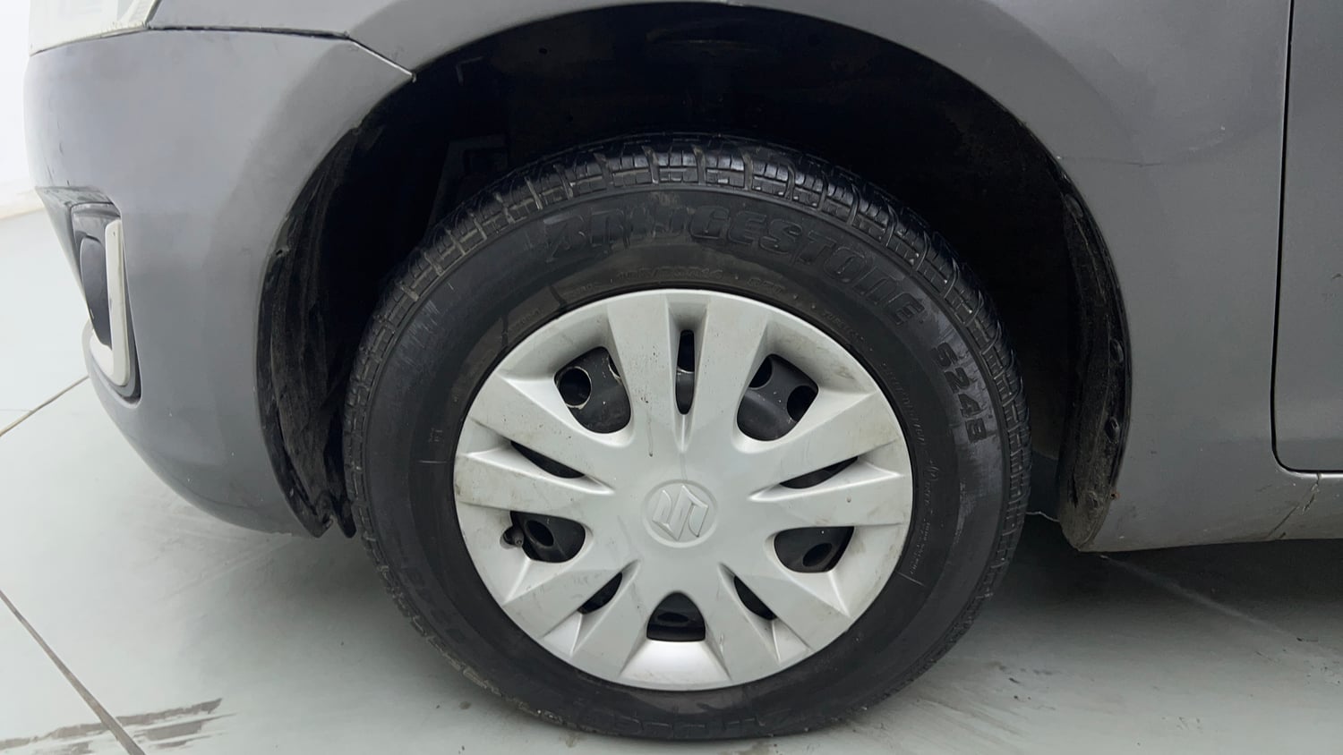 Used 2014 Maruti Suzuki Swift LXi Petrol Manual tyres LEFT FRONT TYRE RIM VIEW