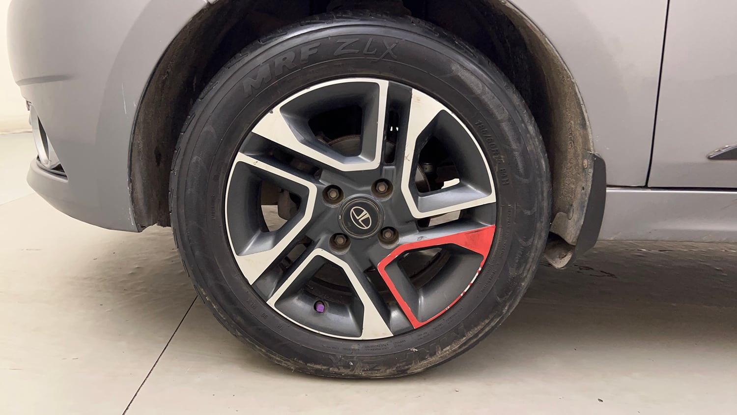 Used 2019 Tata Tigor Revotron XZ+ Petrol Manual tyres LEFT FRONT TYRE RIM VIEW