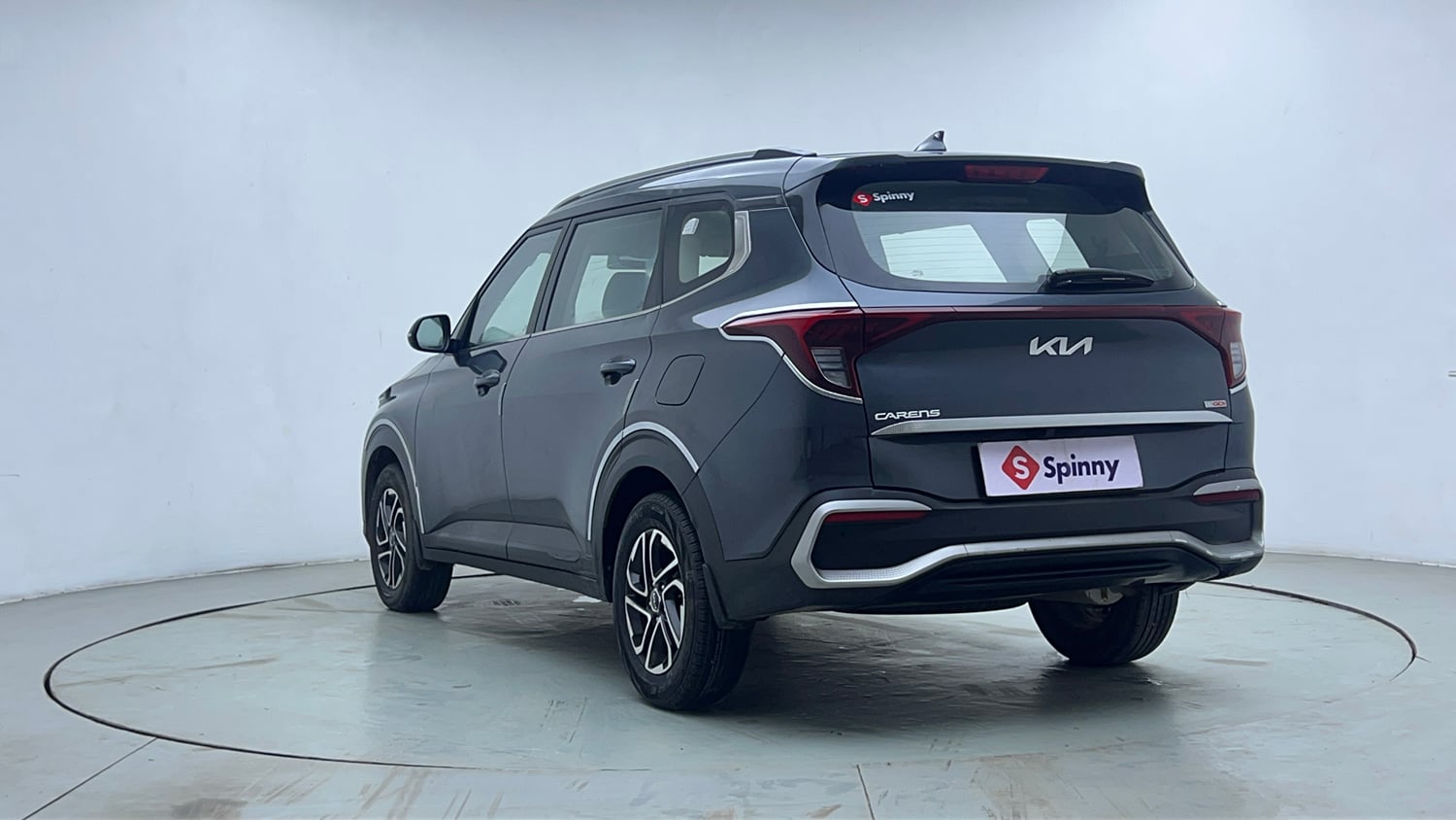 Used 2022 Kia Carens Prestige Plus 1.4 Petrol MT 7 STR Petrol Manual exterior LEFT REAR CORNER VIEW