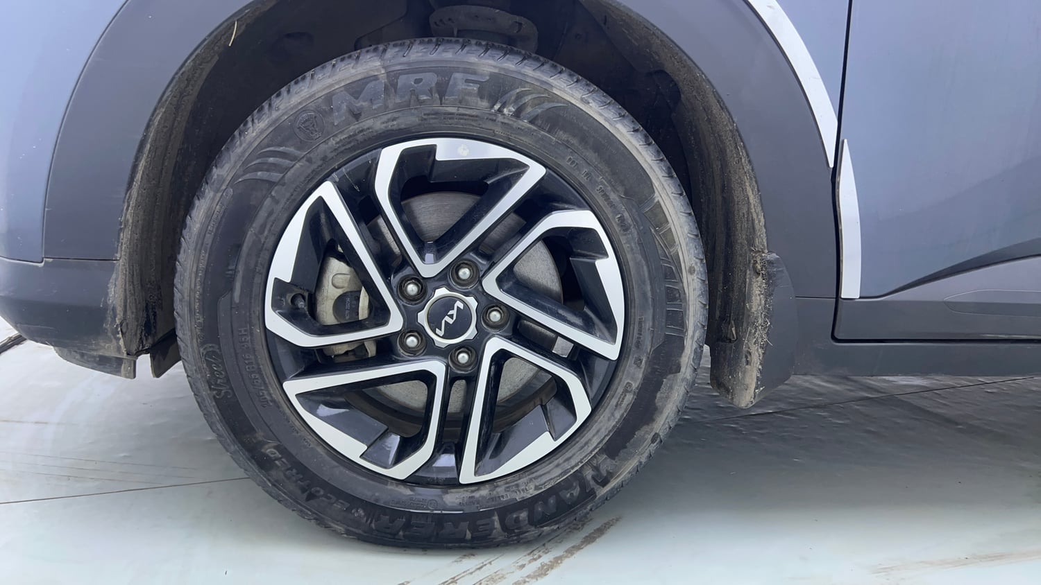 Used 2022 Kia Carens Prestige Plus 1.4 Petrol MT 7 STR Petrol Manual tyres LEFT FRONT TYRE RIM VIEW