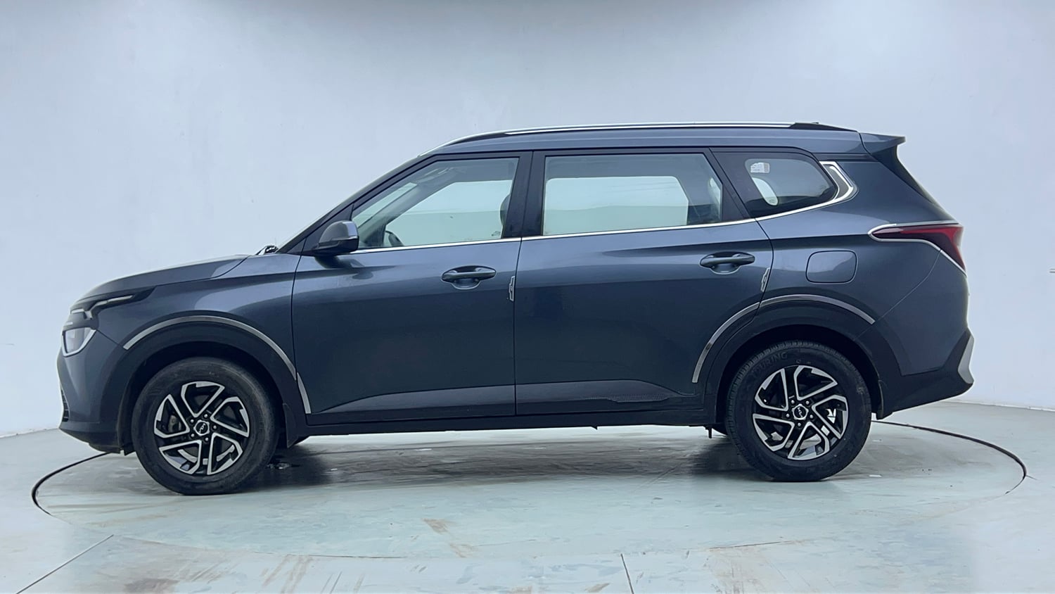 Used 2022 Kia Carens Prestige Plus 1.4 Petrol MT 7 STR Petrol Manual exterior LEFT SIDE VIEW