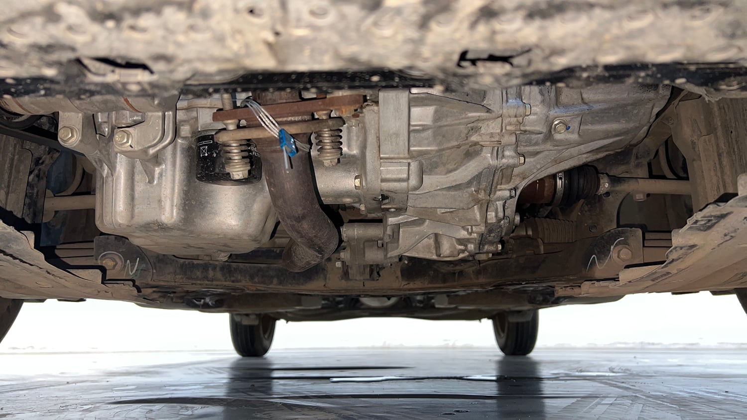 Used 2024 Maruti Suzuki Swift VXi (O) AMT Petrol Automatic extra FRONT LEFT UNDERBODY VIEW