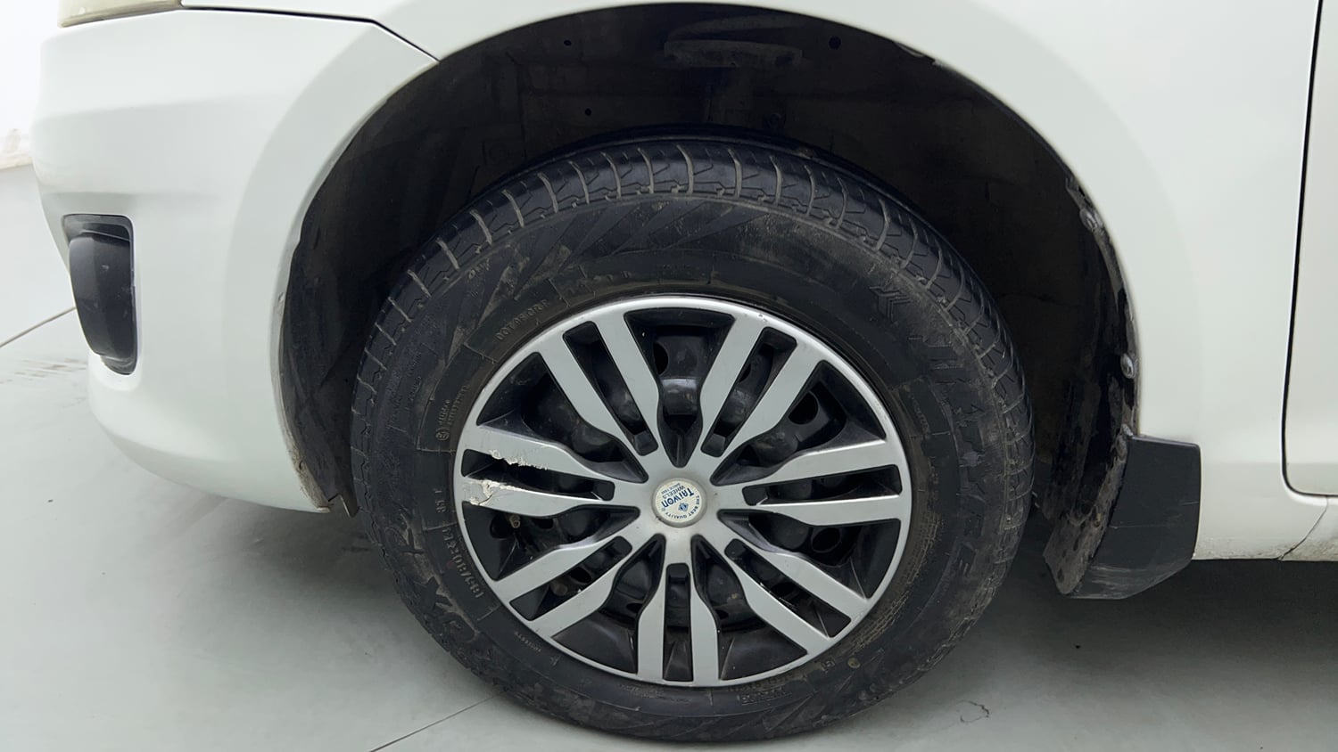 Used 2014 Maruti Suzuki Swift Dzire VXI Petrol Manual tyres LEFT FRONT TYRE RIM VIEW