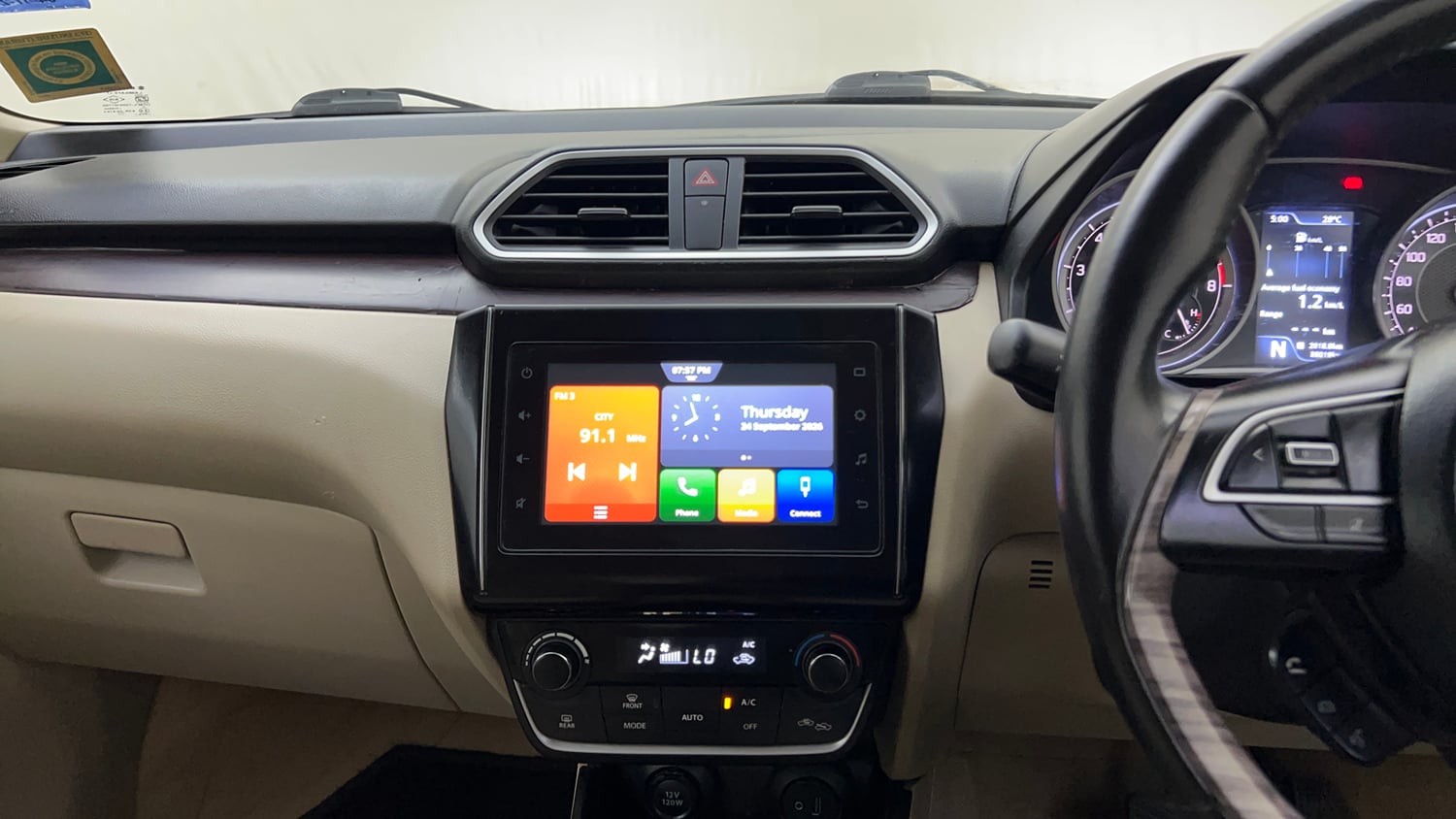Used 2022 Maruti Suzuki Dzire ZXi Plus AGS Petrol Automatic top_features Integrated (in-dash) music system