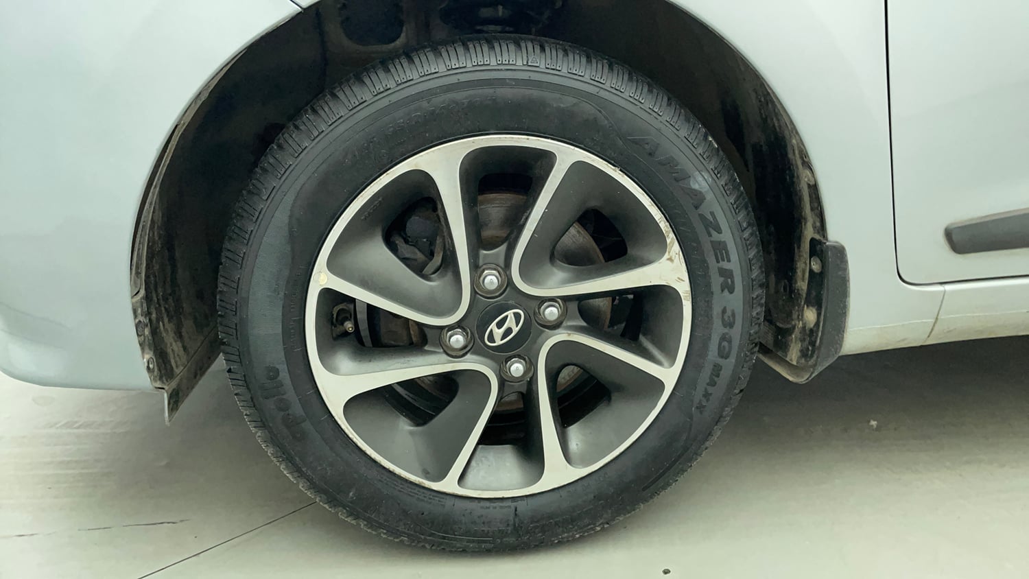 Used 2019 Hyundai Grand i10 Sportz AT 1.2 Kappa VTVT Petrol Automatic tyres LEFT FRONT TYRE RIM VIEW