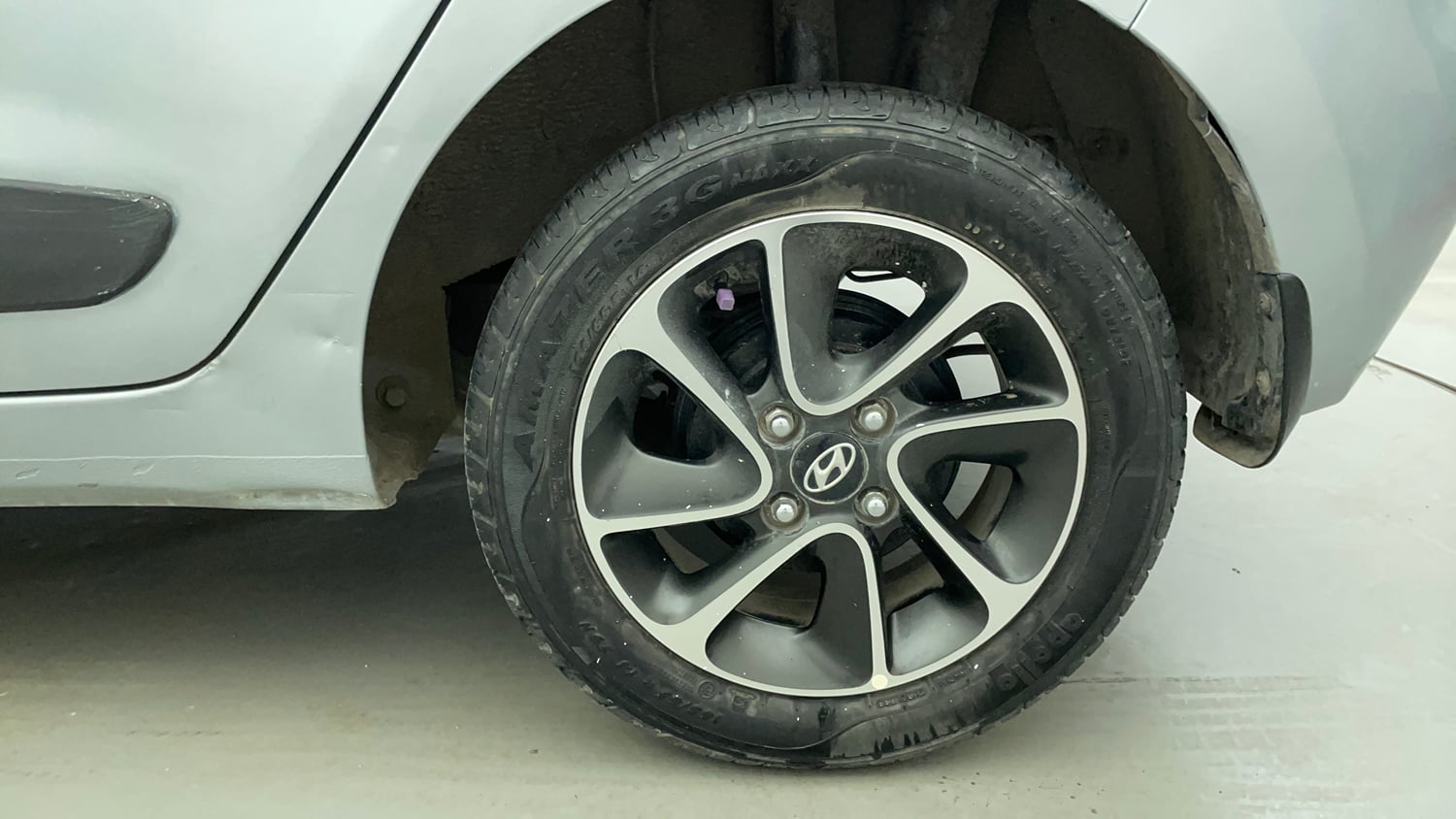 Used 2019 Hyundai Grand i10 Sportz AT 1.2 Kappa VTVT Petrol Automatic tyres LEFT REAR TYRE RIM VIEW