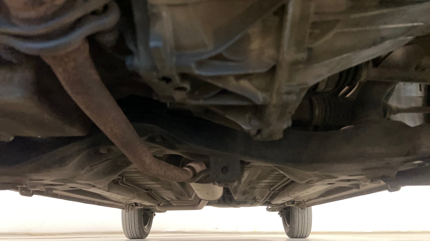 Used 2014 Maruti Suzuki Celerio VXi AMT Petrol Automatic extra FRONT LEFT UNDERBODY VIEW