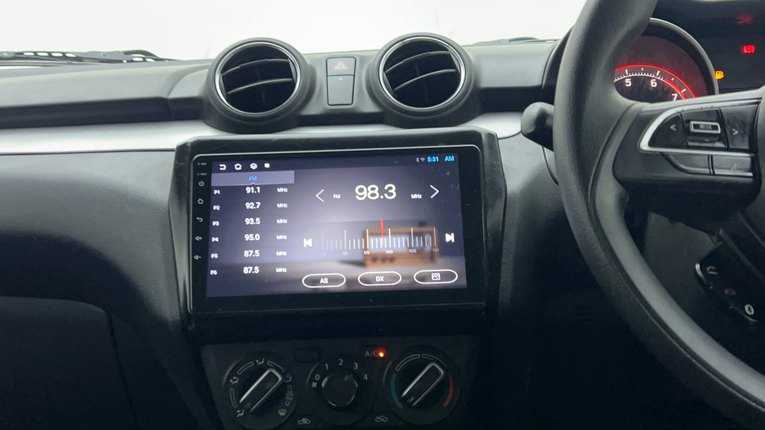 Used 2022 Maruti Suzuki Swift VXi Petrol Manual top_features Integrated (in-dash) music system