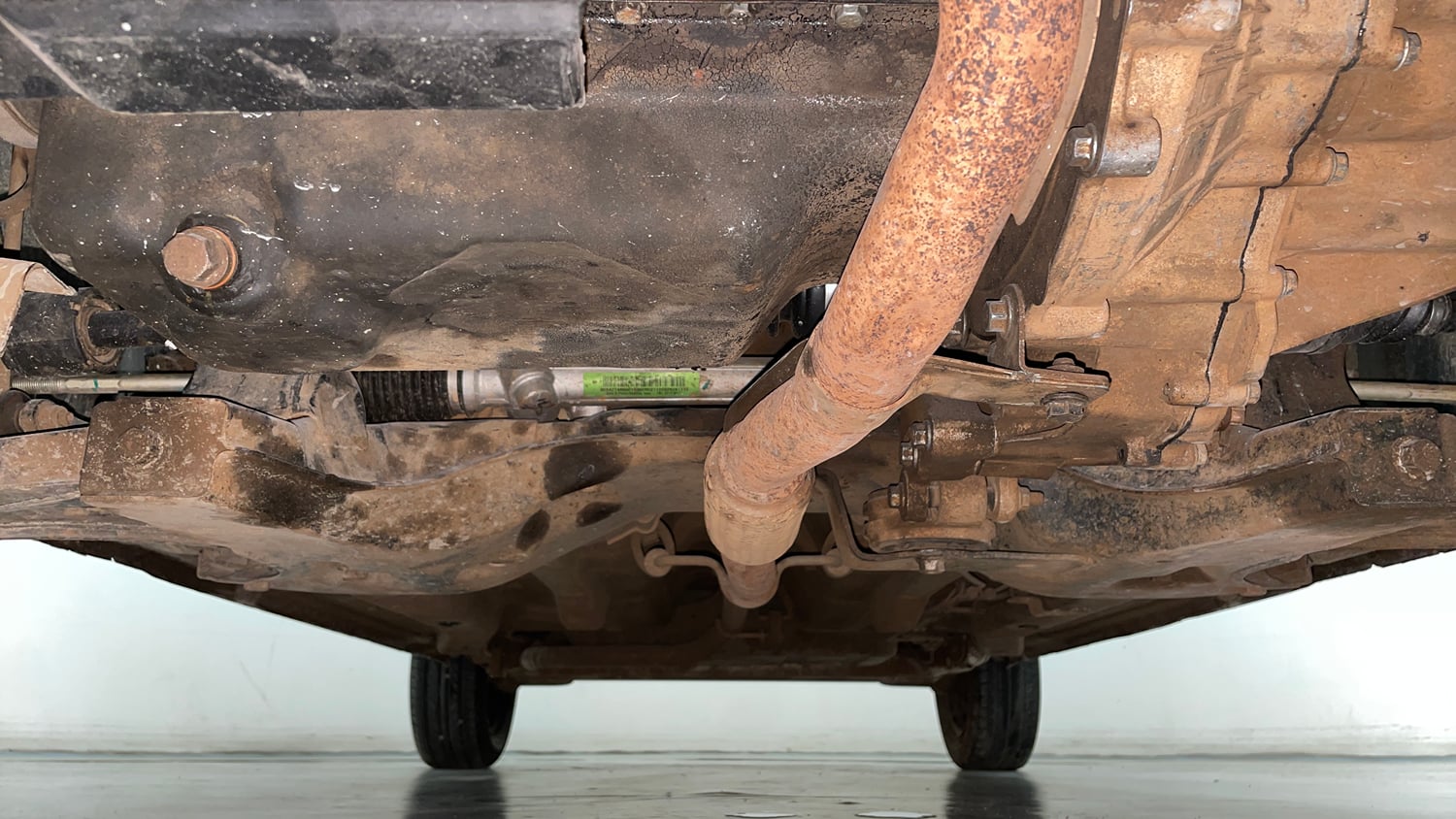 Used 2015 Tata Zest XM Petrol Petrol Manual extra FRONT LEFT UNDERBODY VIEW