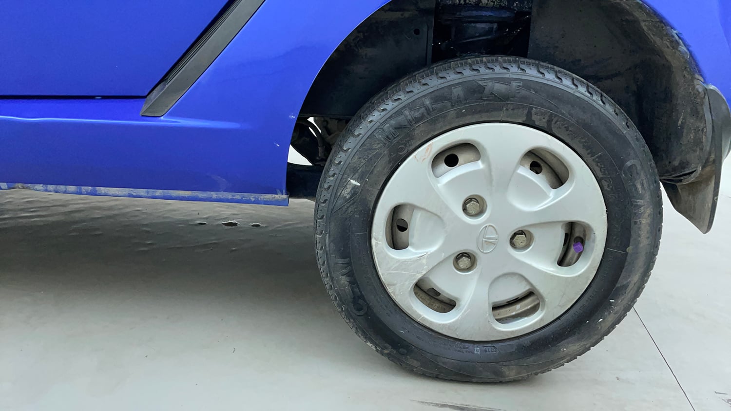 Used 2014 Tata Nano Twist XT Petrol Manual tyres LEFT REAR TYRE RIM VIEW