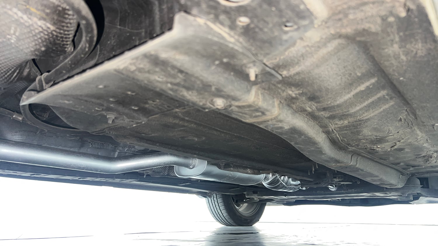 Used 2023 Hyundai New i20 Asta (O) 1.0 Turbo DCT Petrol Automatic extra REAR RIGHT UNDERBODY VIEW