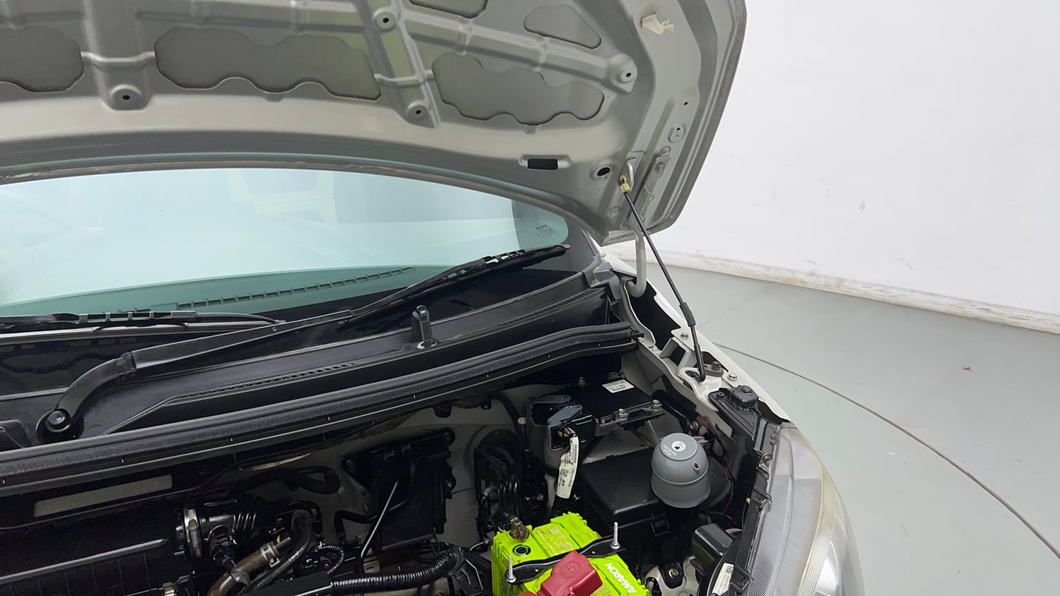 Used 2022 Maruti Suzuki Wagon R 1.0 LXi (O) 1.0 Petrol Manual engine ENGINE LEFT SIDE HINGE & APRON VIEW