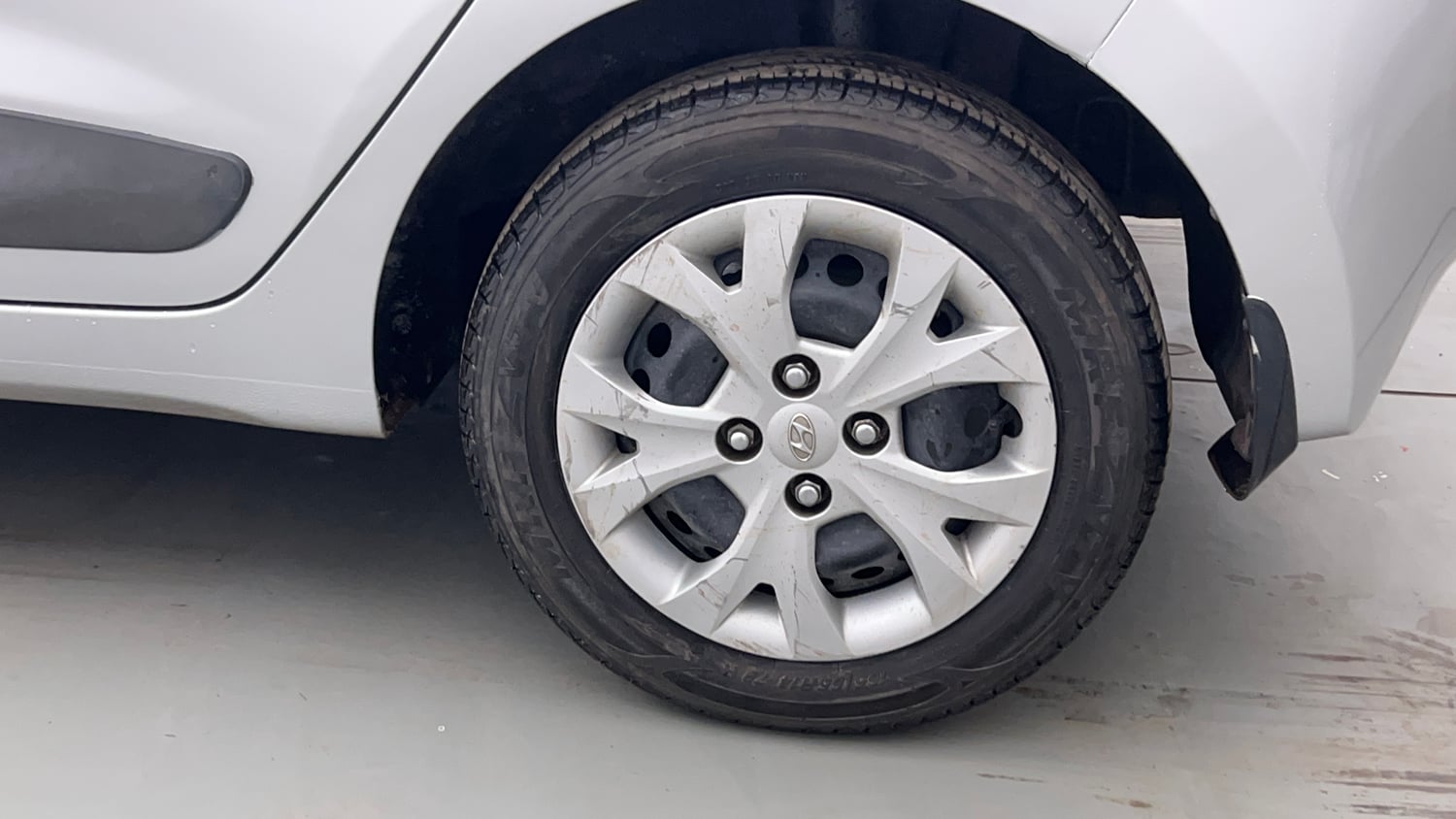 Used 2013 Hyundai Grand i10 Sportz 1.2 Kappa VTVT Petrol Manual tyres LEFT REAR TYRE RIM VIEW